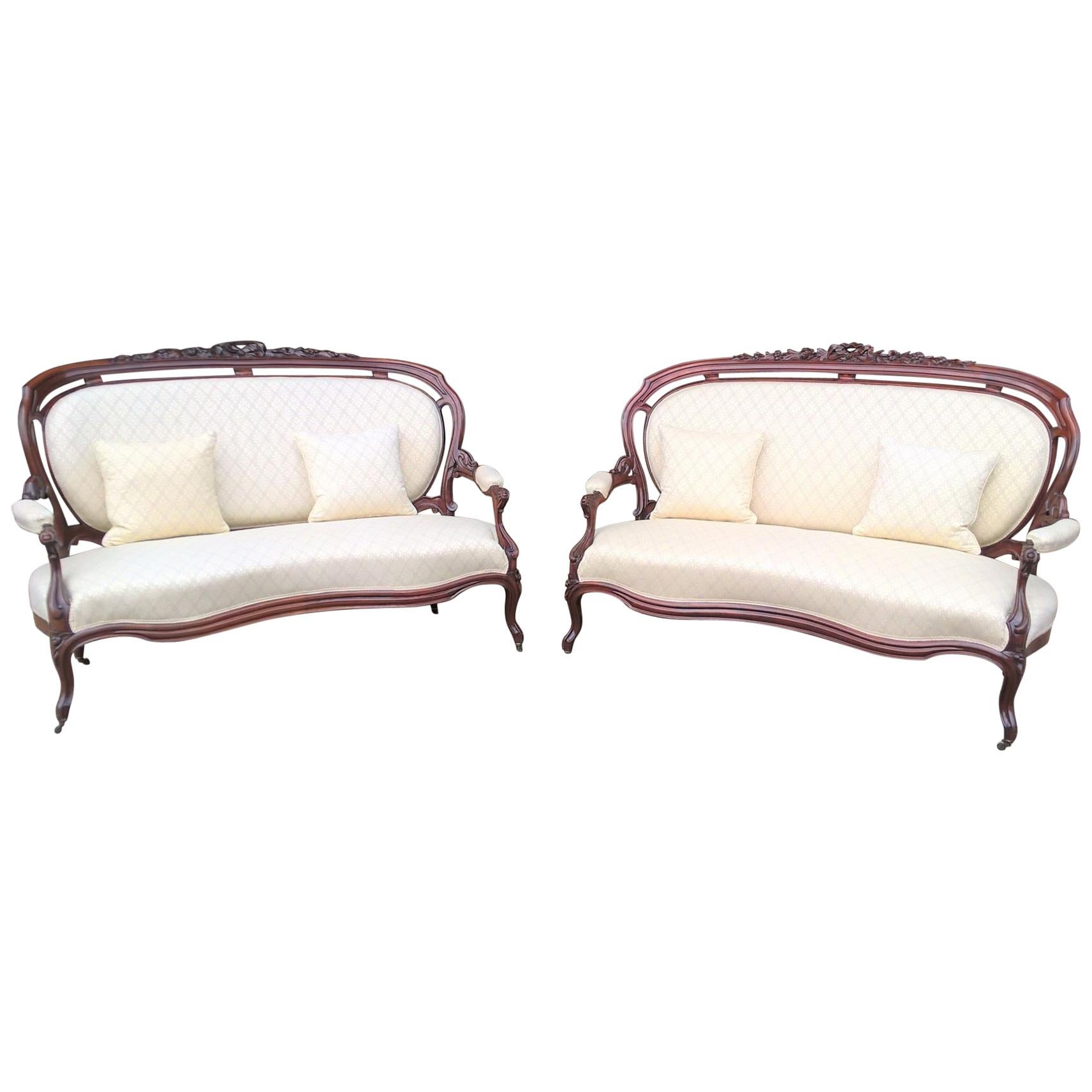 Pair of Mid-19th Century Continental Carved Mahogany Framed Serpentine Sofa's For Sale