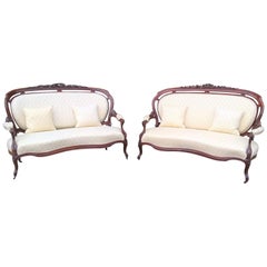 Antique Pair of Mid-19th Century Continental Carved Mahogany Framed Serpentine Sofa's