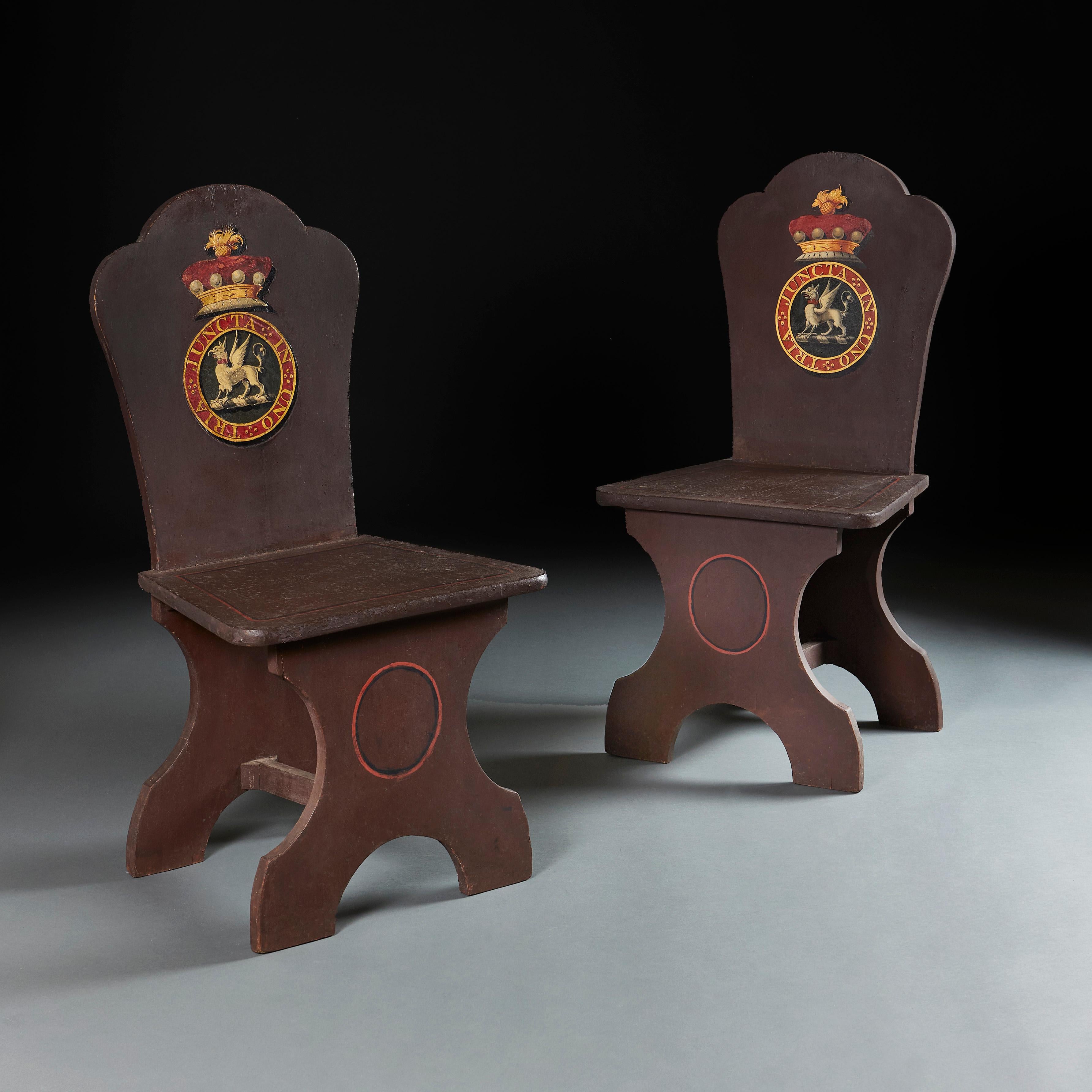 England, circa 1840
Pair of mid 19th century painted hall chairs, with applied armorials, decorated with an Earl’s coronet and the Order of the Bath
Height 99.00cm
Width 51.00cm
Depth 27.00cm
Seat height 46.00cm.