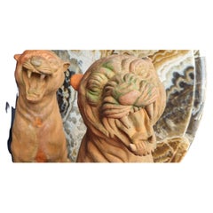 A pair of mid-20th century Italian terracotta garden panthers
