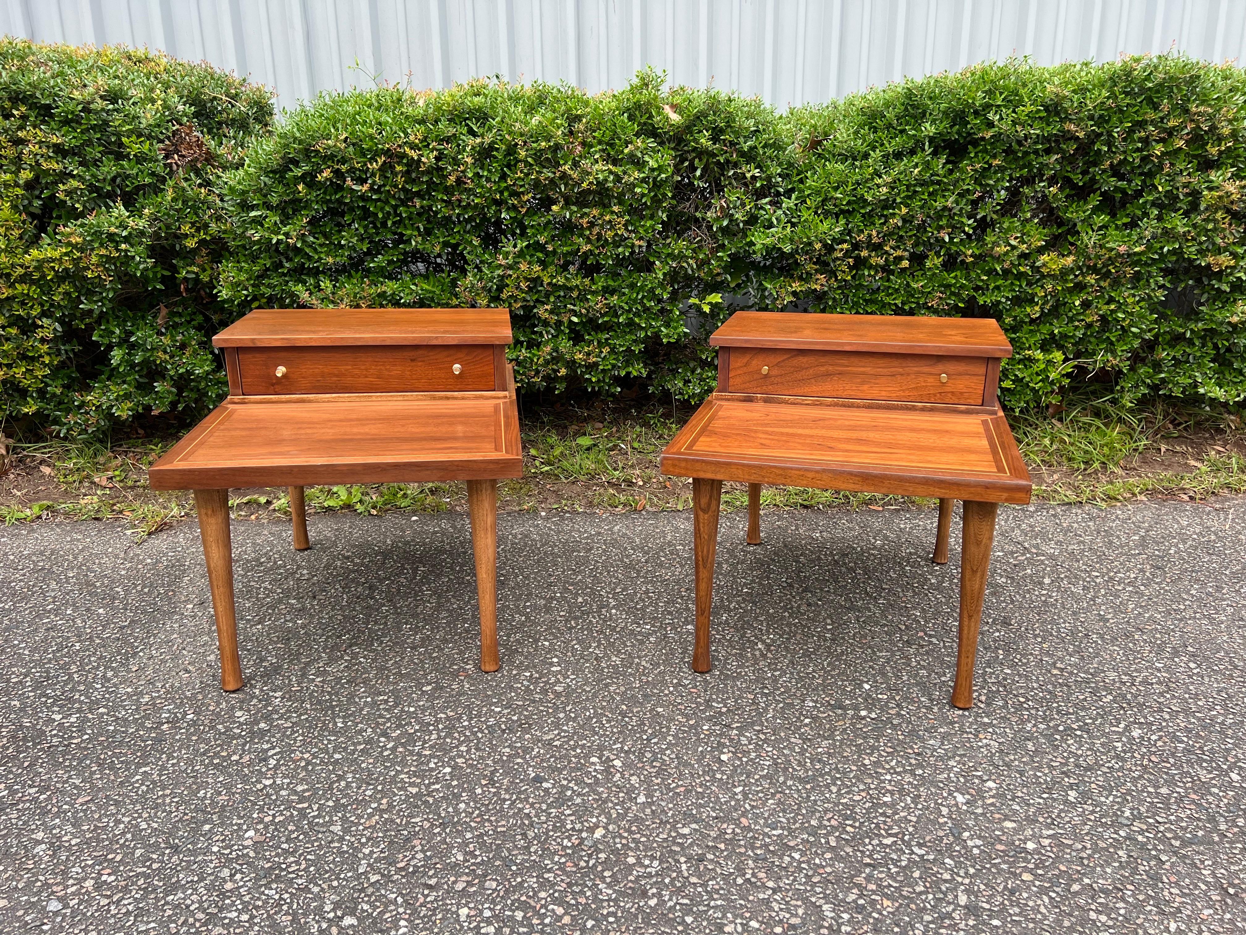 Mid 20th Century American of Martinsville midcentury Side Tables With Drawer
Newly refinished Mid-Century Modern side tables manufactured by American of Martinsville. Sleek brass pulls on the single drawer, a brass inlaid band around the lower