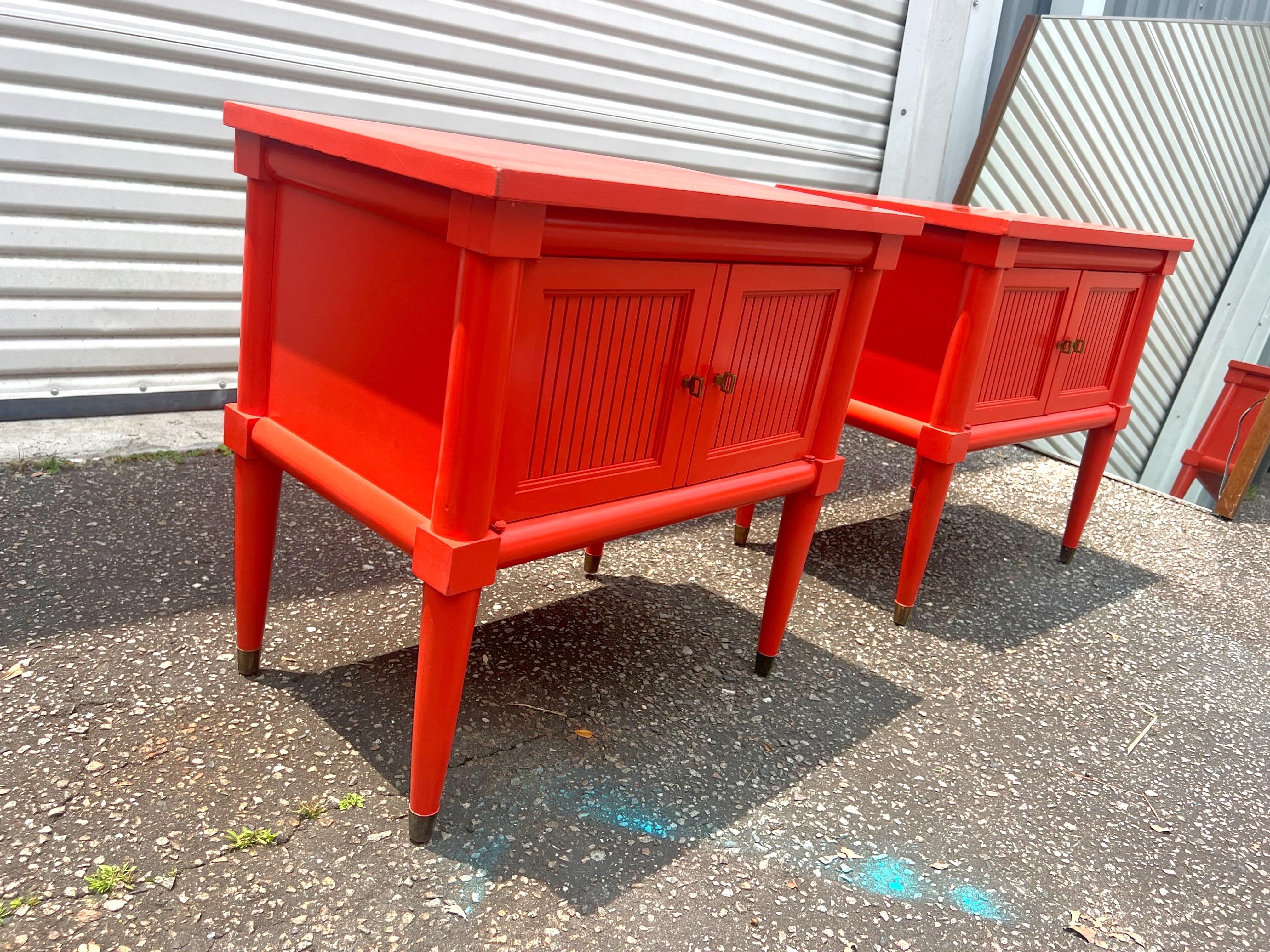 A pair of excellent vintage nightstands lacquered in a high gloss finish. Color matched to Benjamin Moore’s Tomato Red “A radiant orange-red that beams with confidence.” Nightstands circa 1970s.