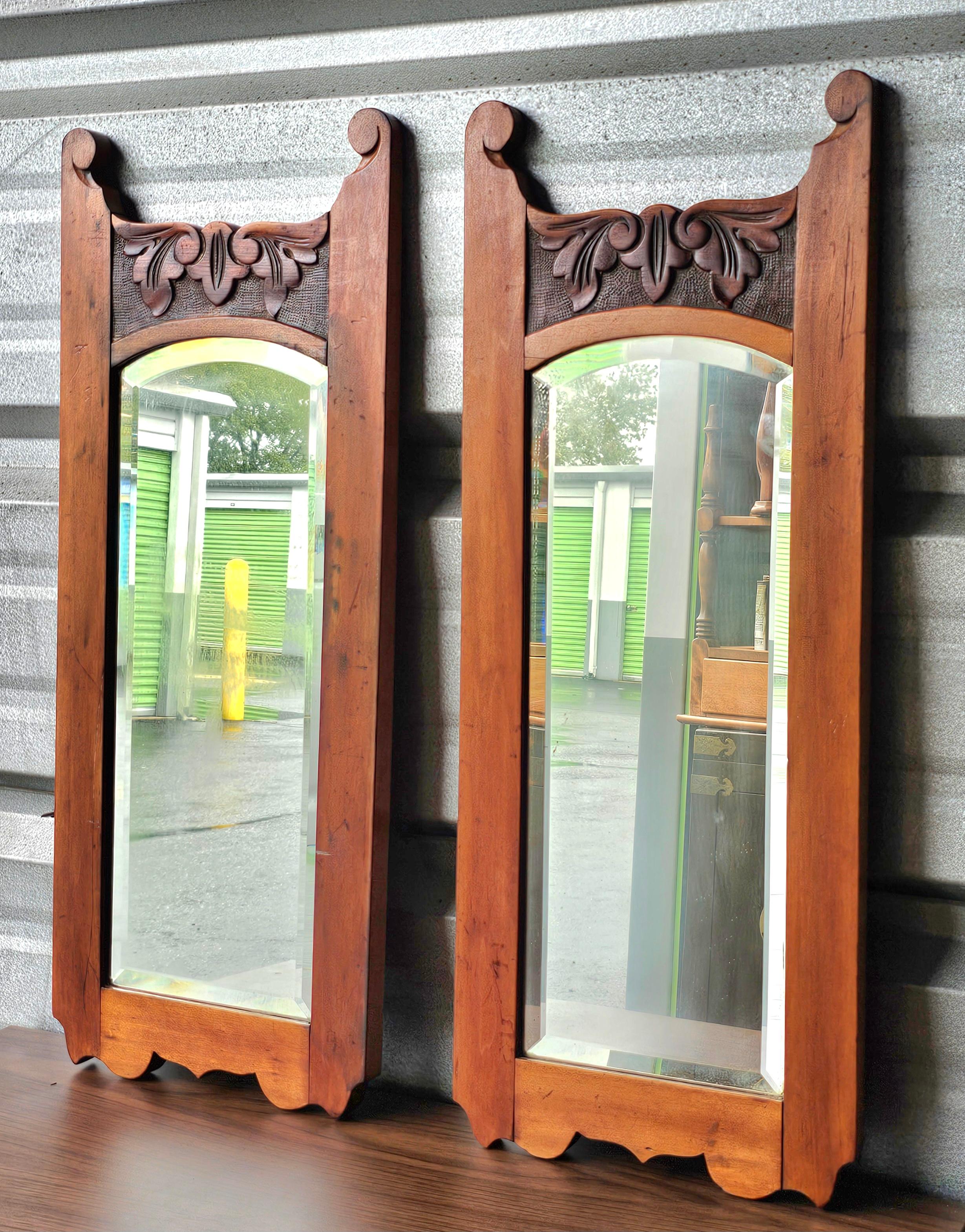 American A Pair of 19th Century Victorian Carved Maple Frame Wall Mirrors For Sale