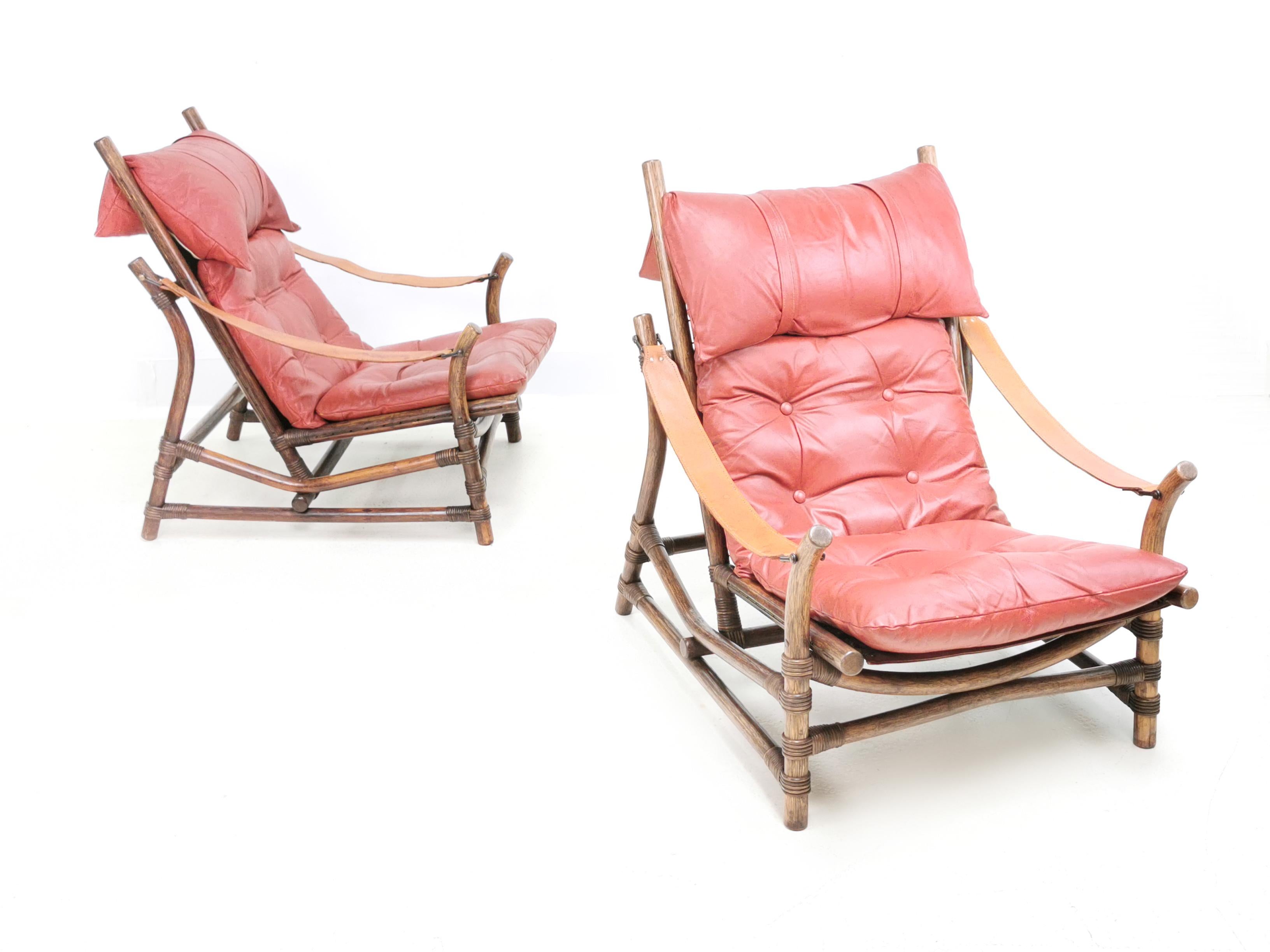 Mid century leather lounge chairs

A pair of leather strap armchairs. The pads are in red leather, and they sit on Pirelli stretchers, making them extremely comfortable.

The frames are bamboo with rattan loops. Quality chairs and made in