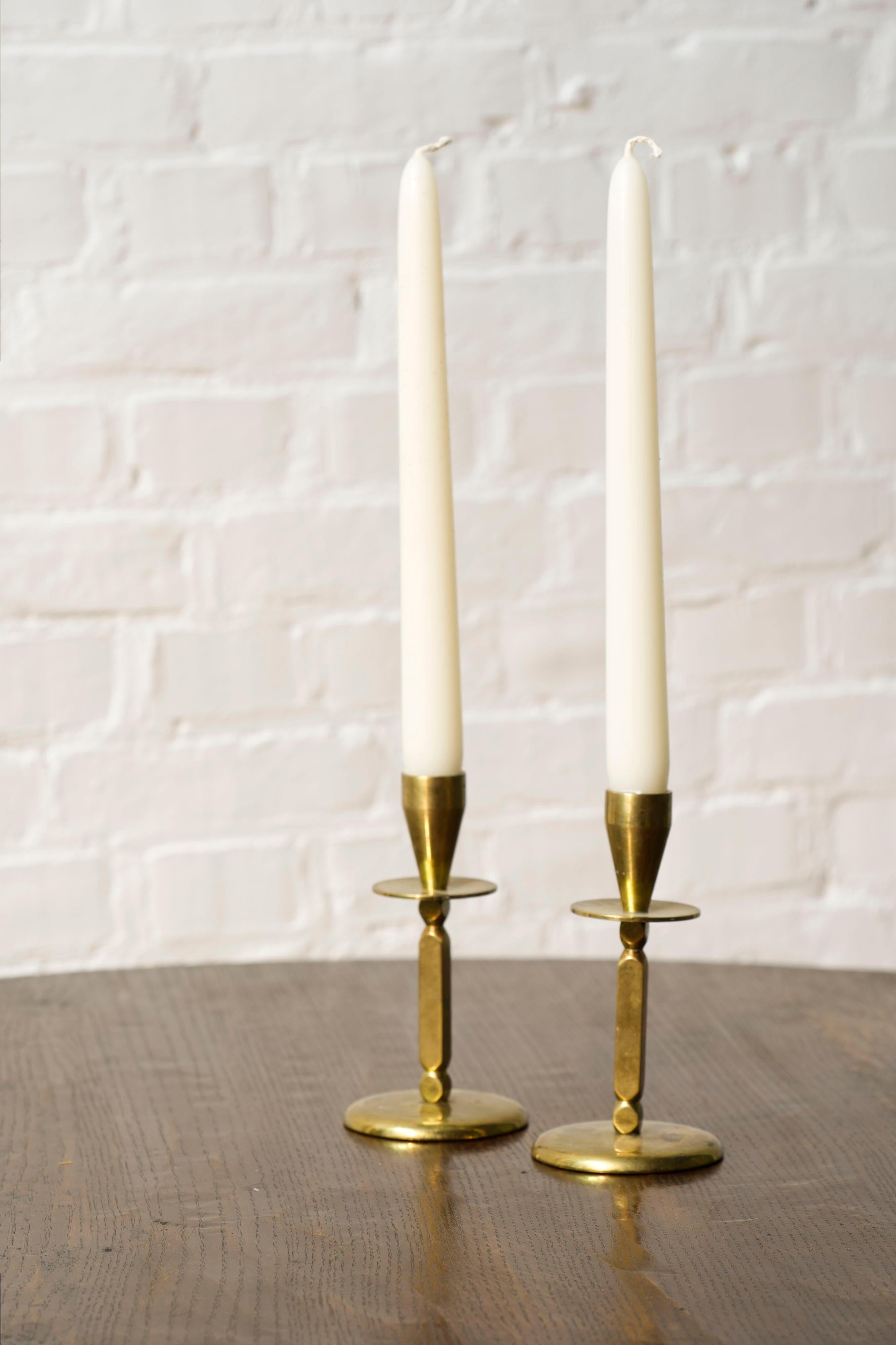 A pair of Mid century brass candle sticks, Kara Denmark.

Solid brass and quality made in Denmark. Marked by the maker at the bottom.

A vintage pair with some age and patina marks.
