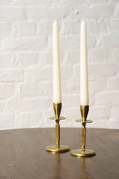 A pair of Mid century brass candle sticks, Kara Denmark