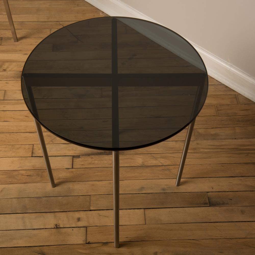 A pair of midcentury chrome and glass round side table, circa 1950s.
 Can be sold separately.