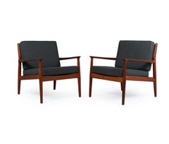 Pair of Mid century Danish Solid Teak framed Armchairs with upholstered cushions