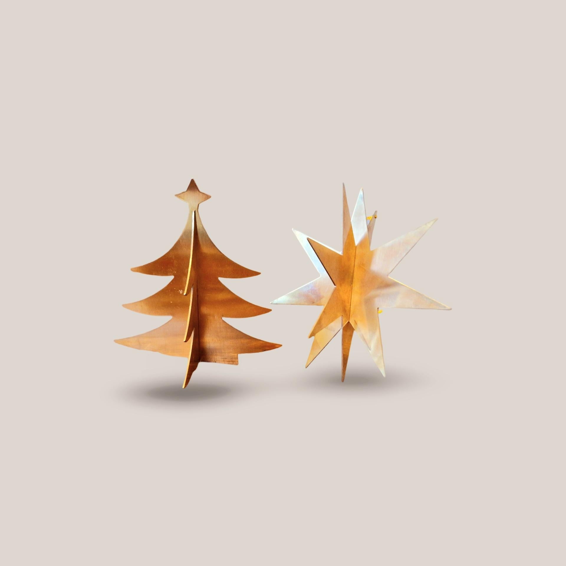 Mid-century Danish Christmas
Vintage 1970s Gold-Plated Christmas Ornaments – A Touch of Timeless Elegance

Add a dash of 1970s nostalgia and luxury to your holiday decor with this exquisite pair of gold-plated Christmas ornaments. Shaped as a