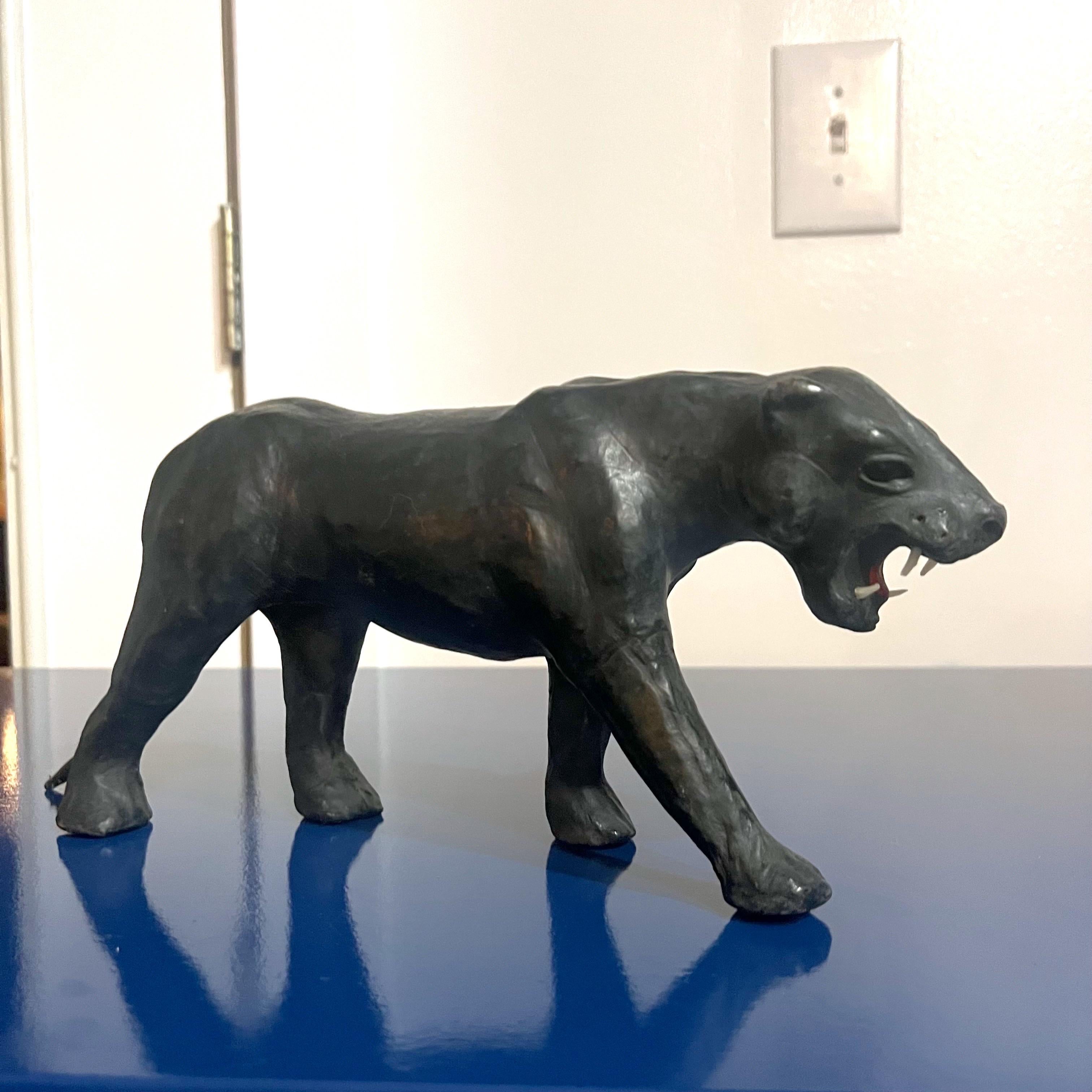For your consideration we have 2 mid-20th century era “big cat” leather wrapped animals. One being a panther who seems to be slowly approaching his prey. And the second is a cheetah who appears to be running towards his or her prey. Both are