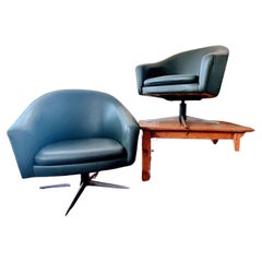A pair of mid century Hungarian swivel tub chairs A pair of mid century Hungarian swivel tub chairs