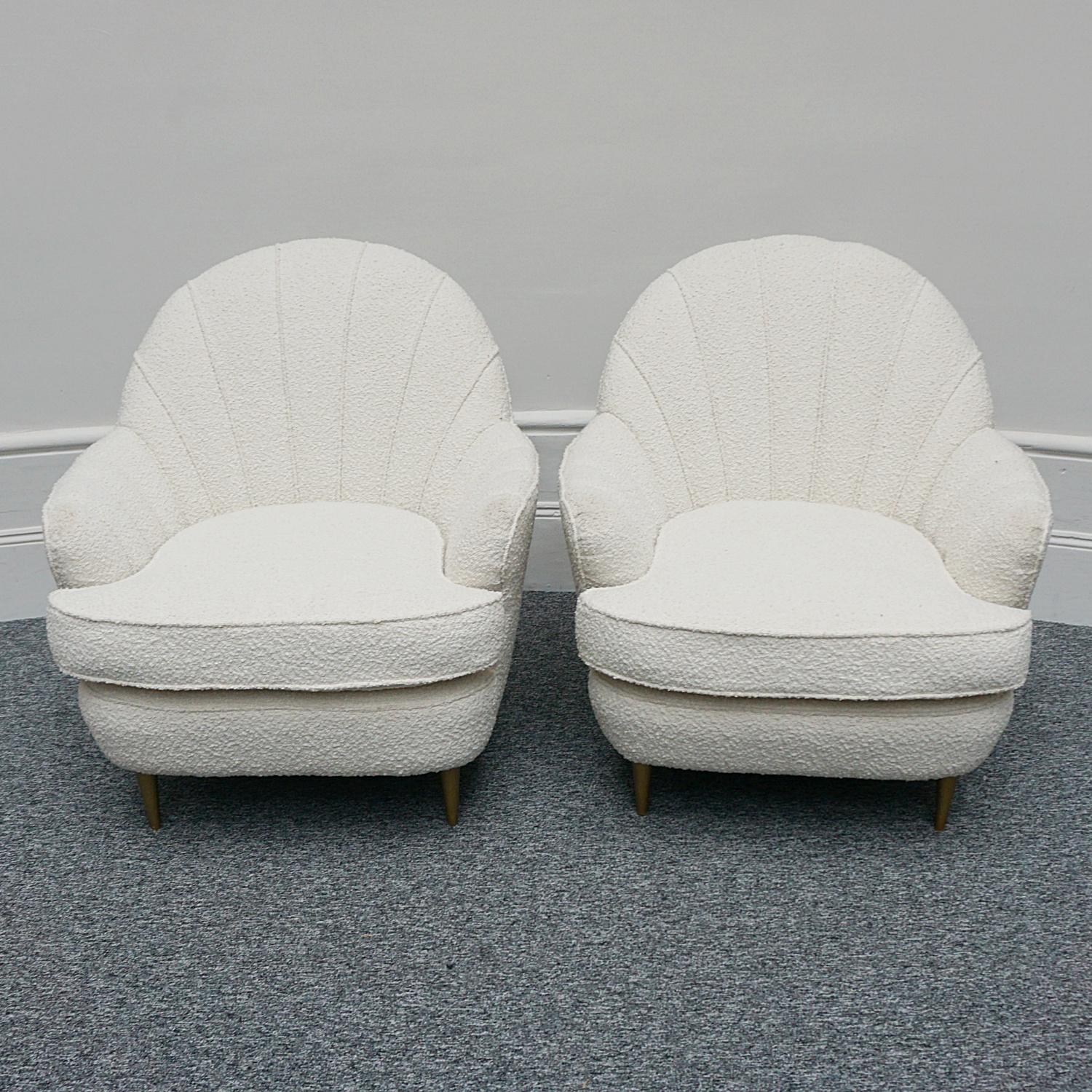 A pair of Mid-Century lounge chairs with a shell shaped back and gold painted legs. Re-upholstered in white Bouclé.

Dimensions: H 88cm W 85cm D 59cm Seat H 47cm

Origin: Italian

Date: Circa 1950

Item Number: 0102231

All of our