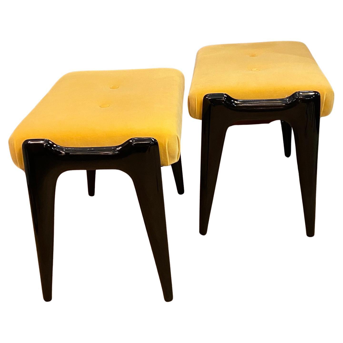 Ebonized A pair of mid-century Italian stools, yellow velour and ebonized wooden legs