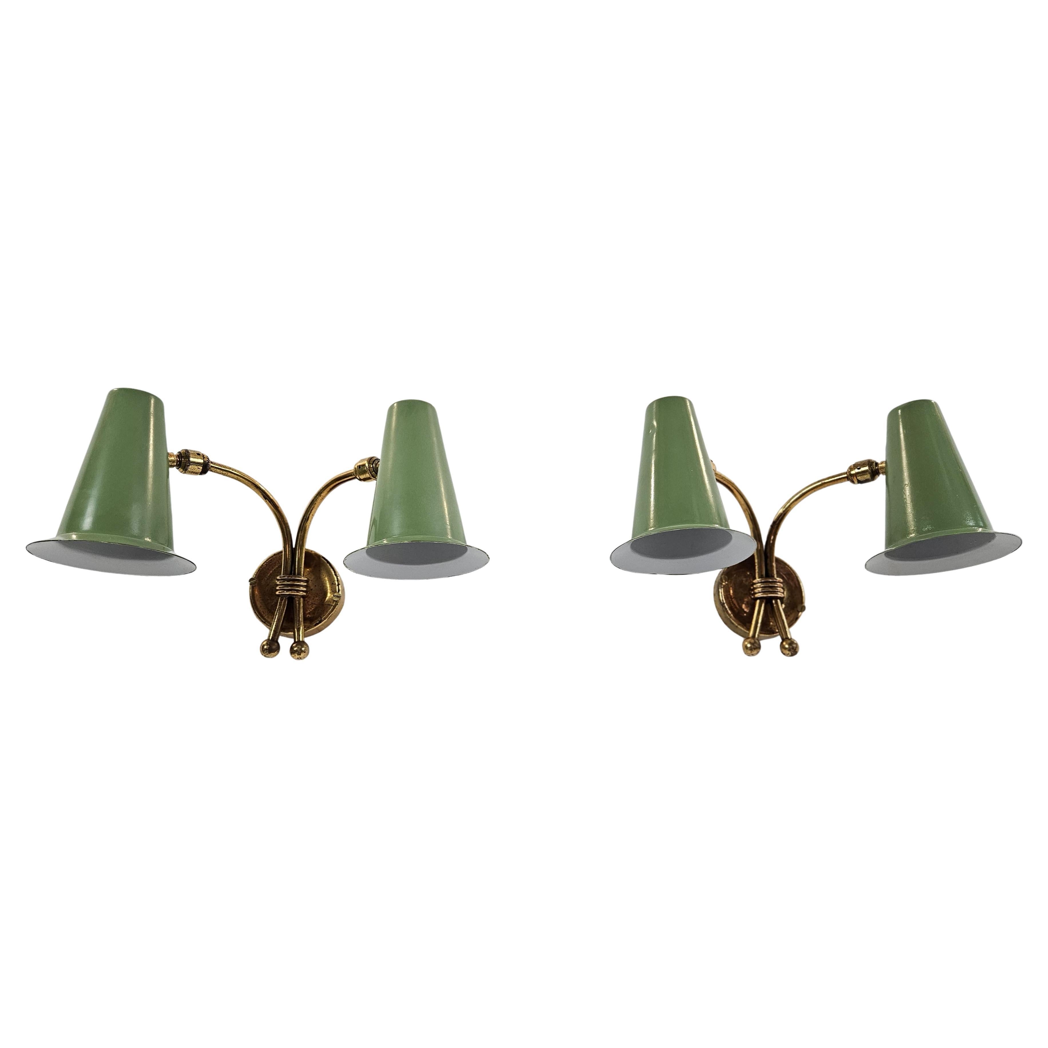 Classic pair of wall sconces in green and gold 1950's wall lights in the manner of Stilnovo Italy. The light cones are adjustable in all angles. The coating is new and in good condition and the brass has been kept as it is with signs of age which