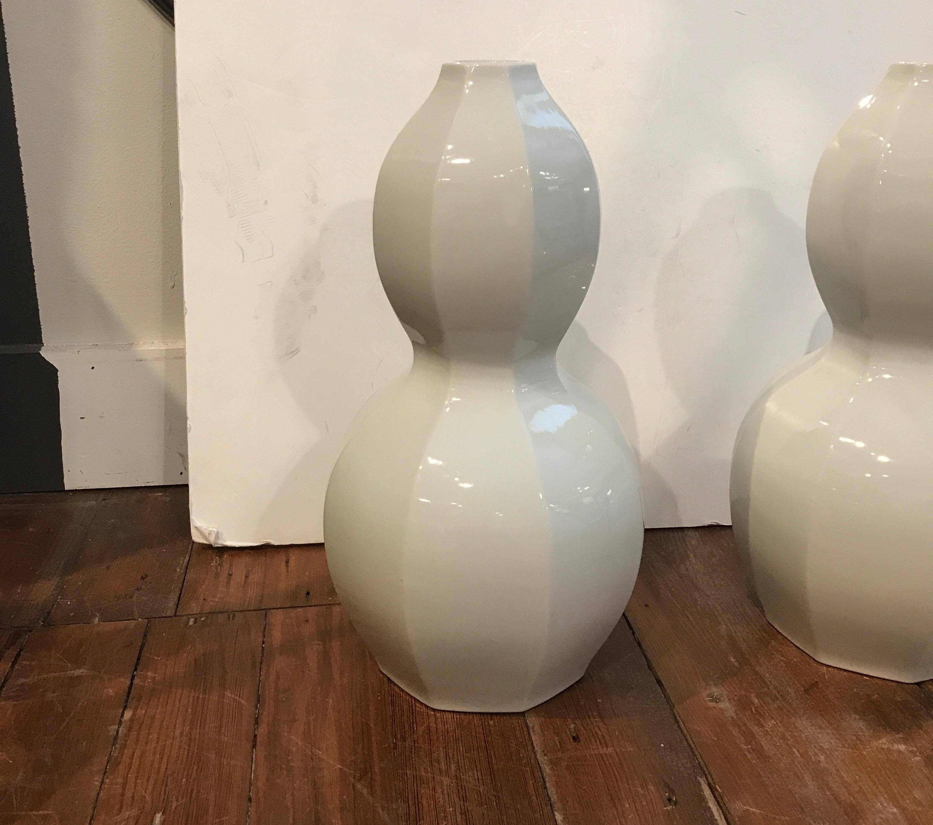 A chic pair of Japanese white porcelain gourd form vases, mid 20th century, 17 inches tall.
