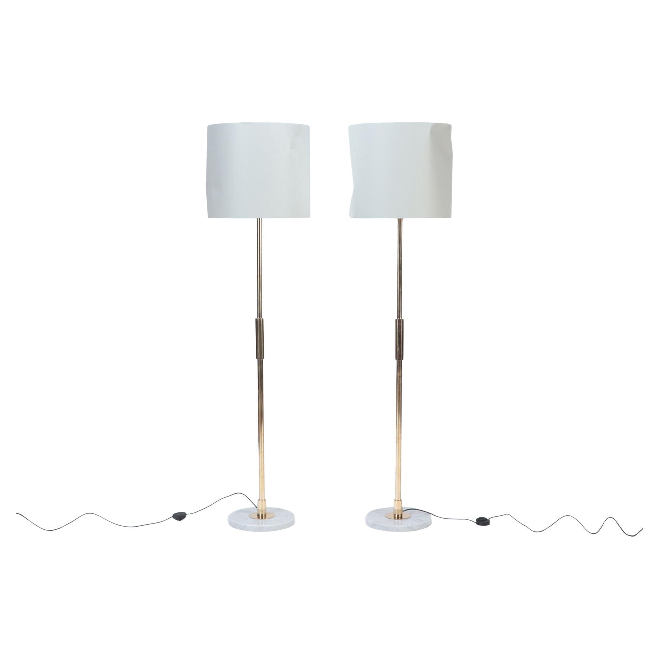 A pair of Mid Century Modern brass floor lamps, circa 1950. For Sale