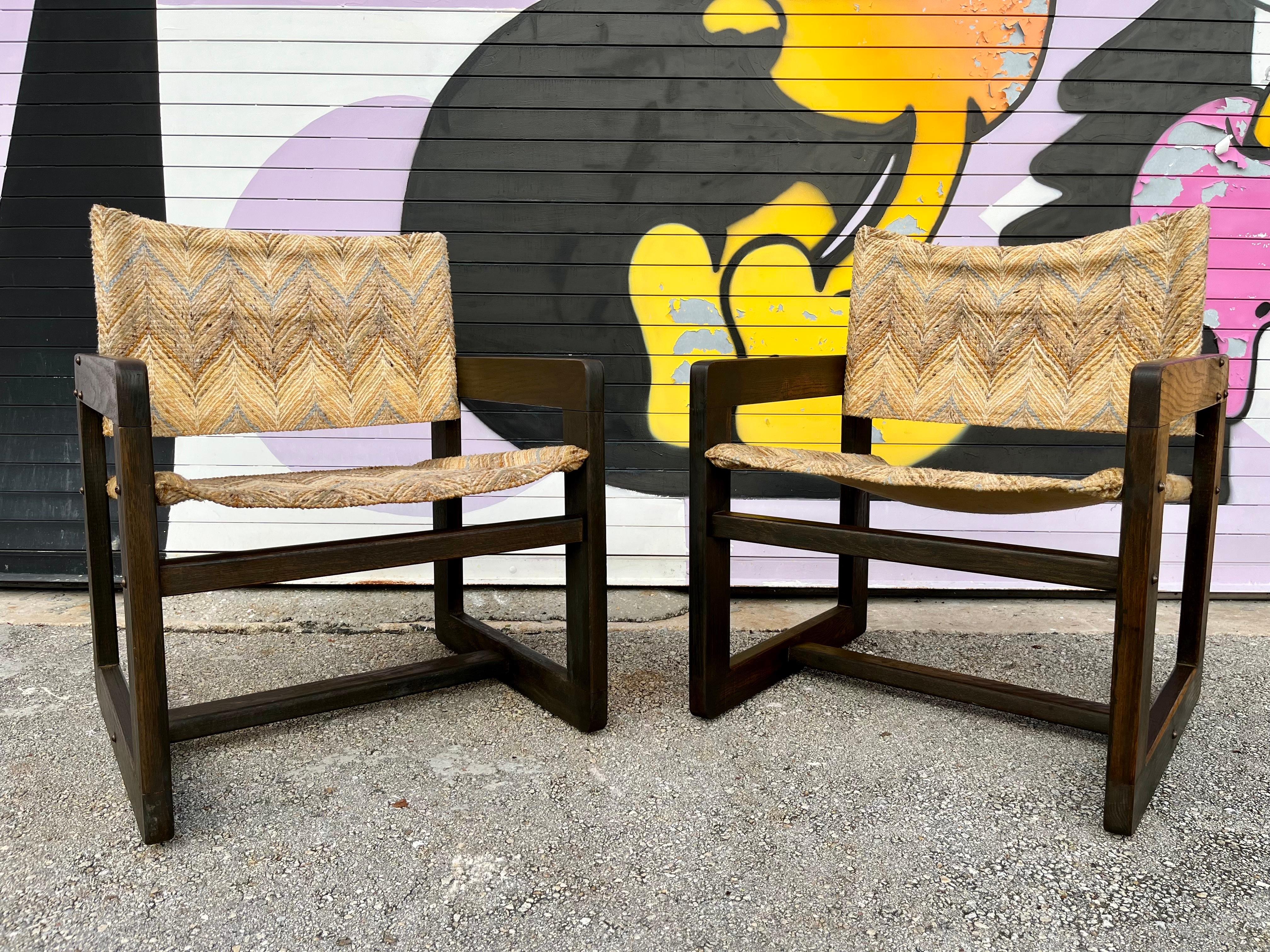 A Pair of Vintage Mid Century Modern Cube Lounge Chairs in the Karin Mobring Diana Armchairs Style. Circa 1970s
Feature a minimalist cubic design, a solid wood frame with a rich wood grain and the original Missoni Chevron Pattern Style Fabric. 
In
