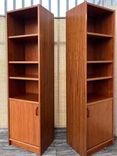A pair of Mid Century Modern Danish Bookcases with Storage Cabinets. Circa 1970s