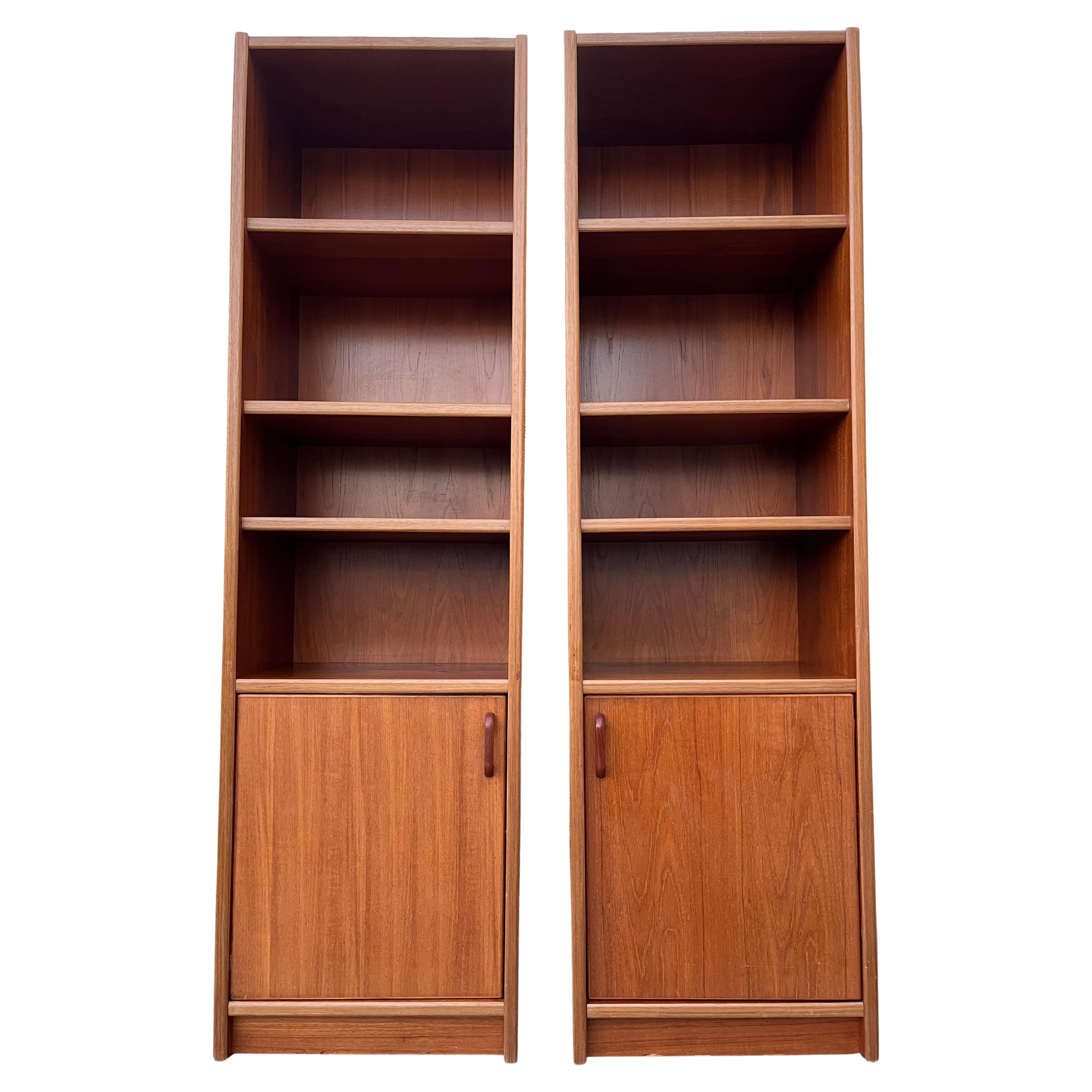 A pair of Mid Century Modern Danish Bookcases with Storage Cabinets. Circa 1970s