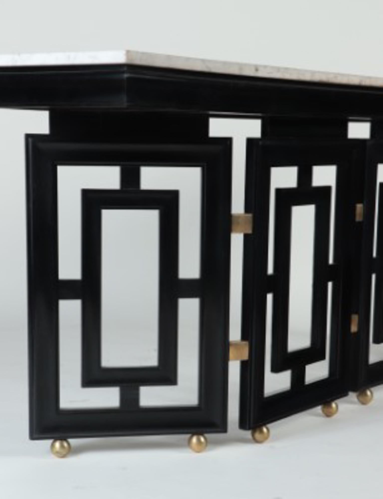 A unique pair of Midcentury Modern Parzinger style, ebonized, marble top console tables circa 1950.