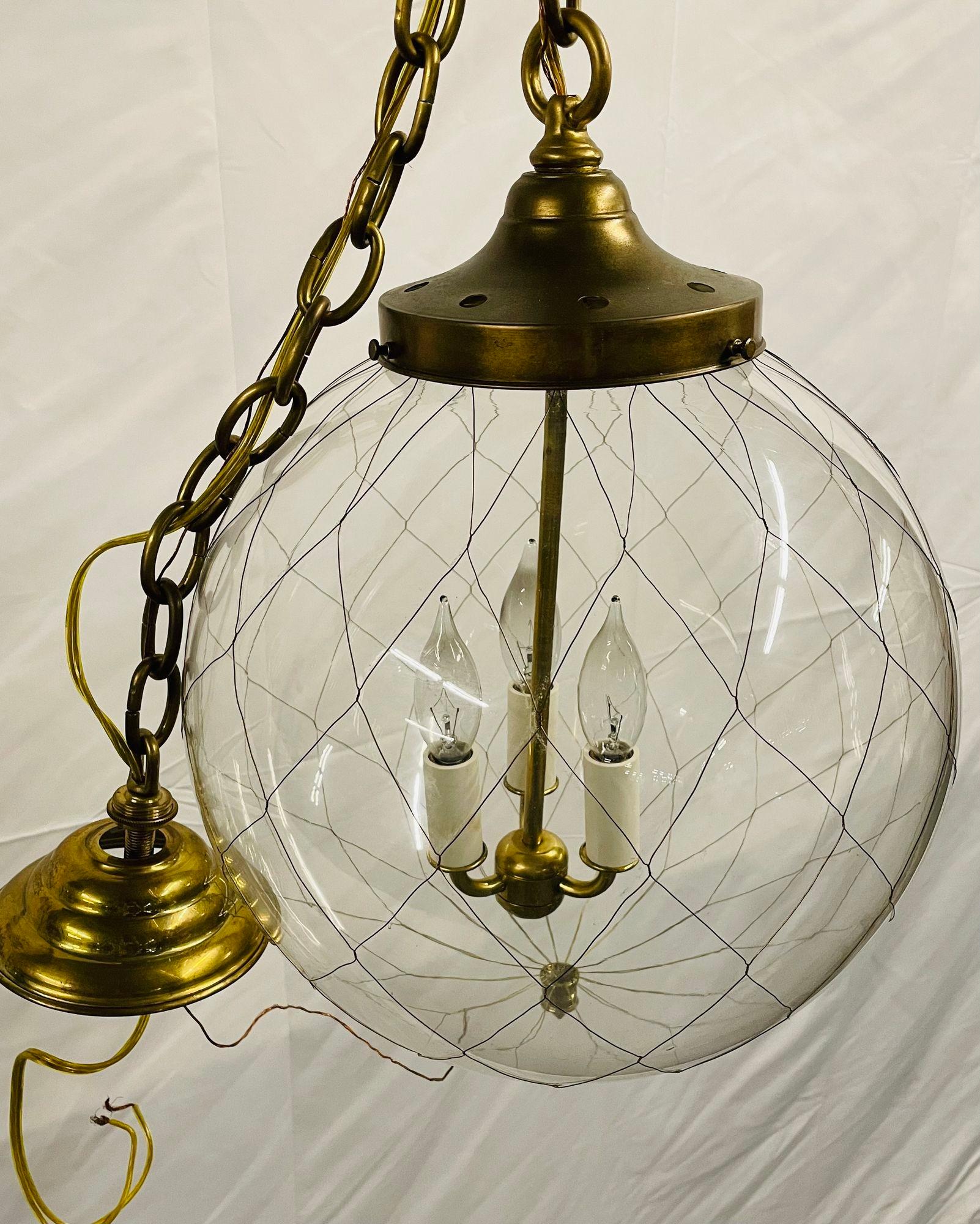 French Pair of Mid-Century Modern Globe Pendants, Brass and Hand Blown Glass For Sale