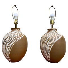 A Pair of Mid Century Modern Large Lava Glazed Ceramic Lamps. Circa 1960s