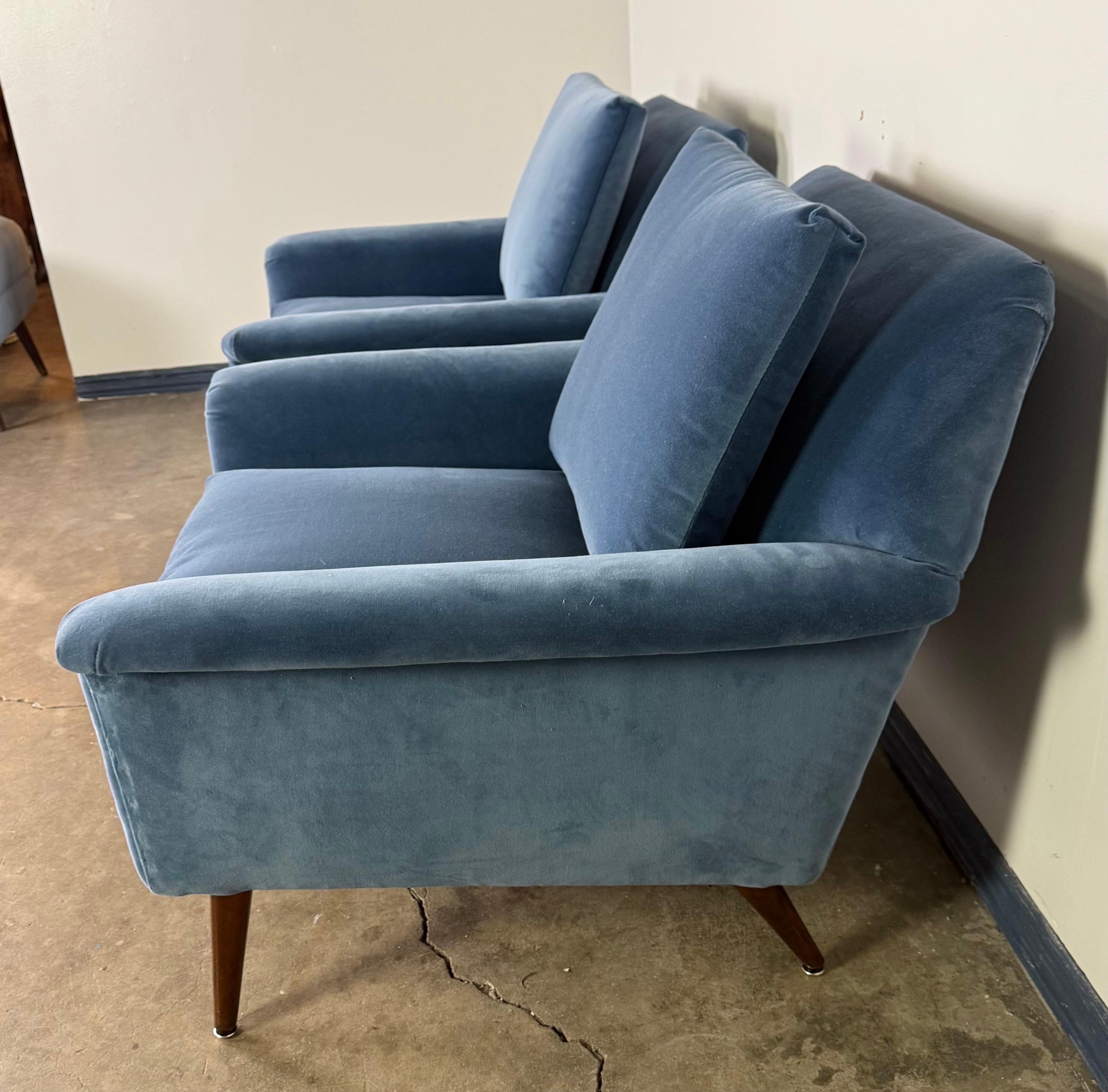 Brass A pair of Mid-Century Modern lounge chairs designed by Folke Ohlsson For Sale
