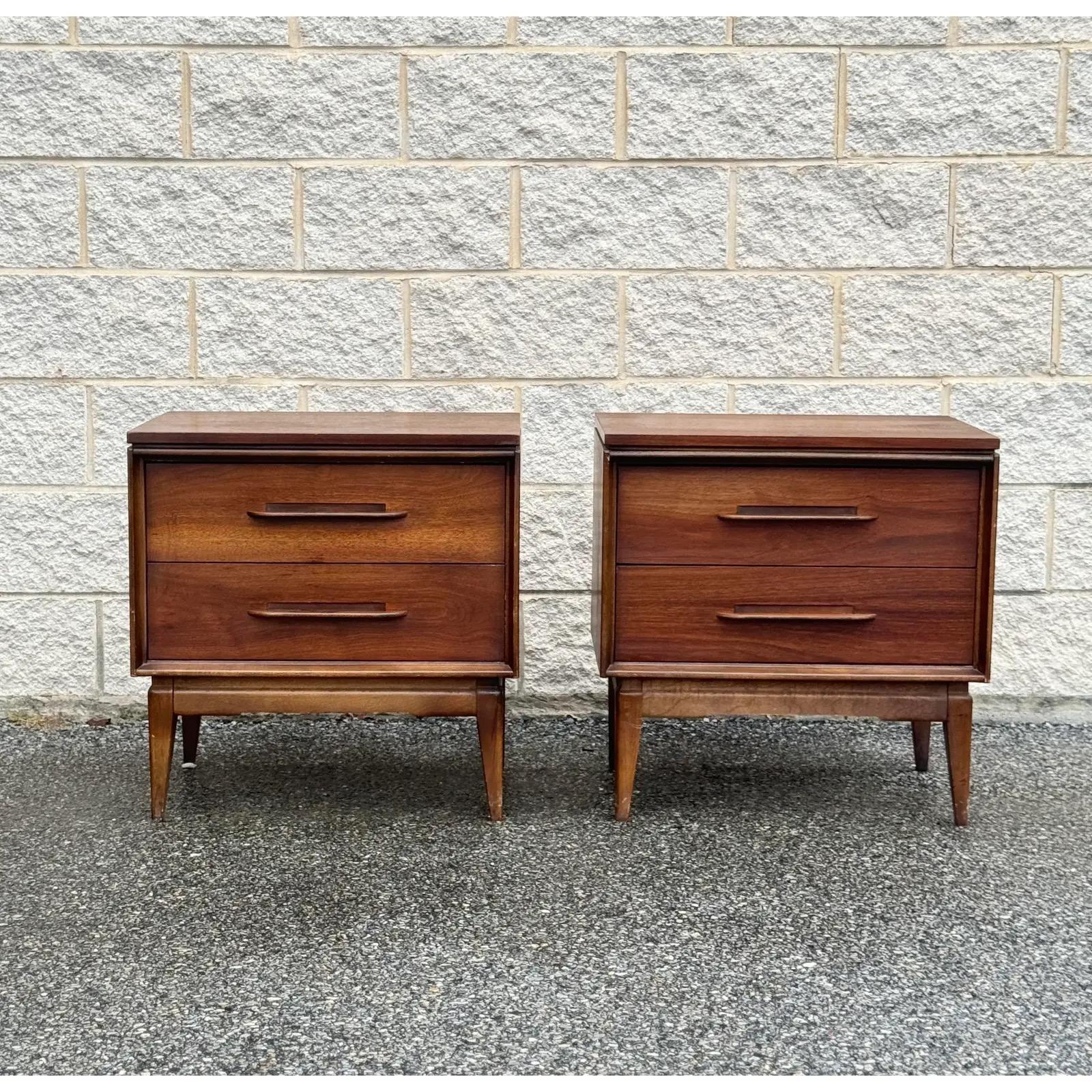 Walnut A Pair of Mid Century Modern Nightstands by Bassett
