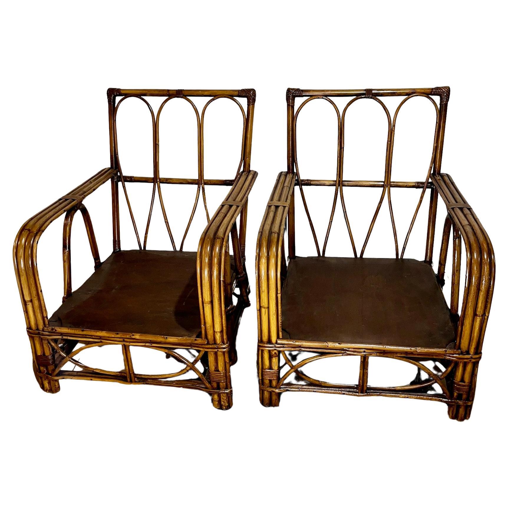 A pair of Mid Century Modern Rattan Club Chairs For Sale