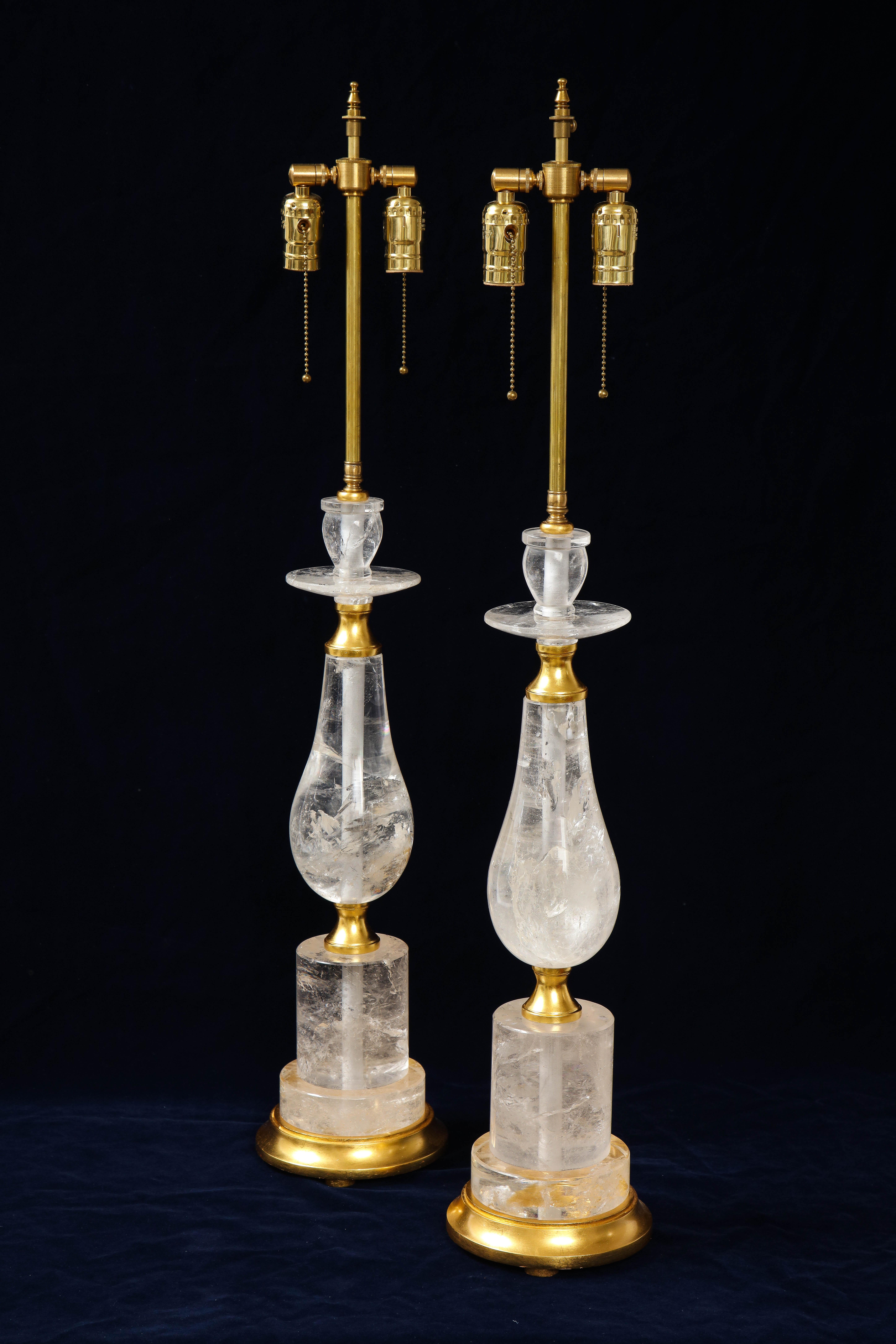 A gorgeous pair of Mid-Century Modern rock crystal quartz mounted lamps, attributed to 