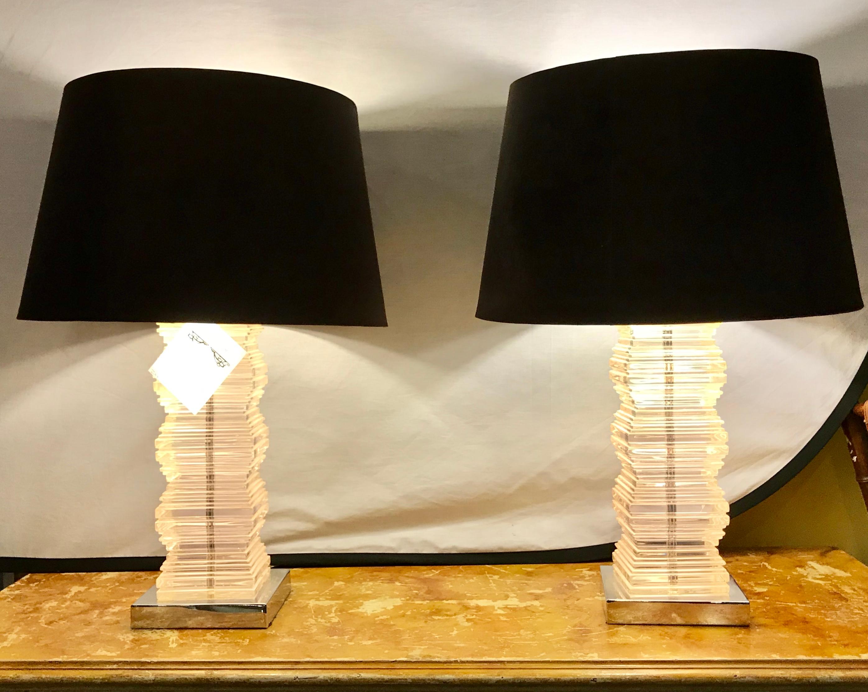 A pair of Mid-Century Modern stacked lucite table lamps. Shades not included.