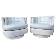 Pair of Mid-Century Modern White Vinyl Tufted Back Barrel Swivel Club Chairs