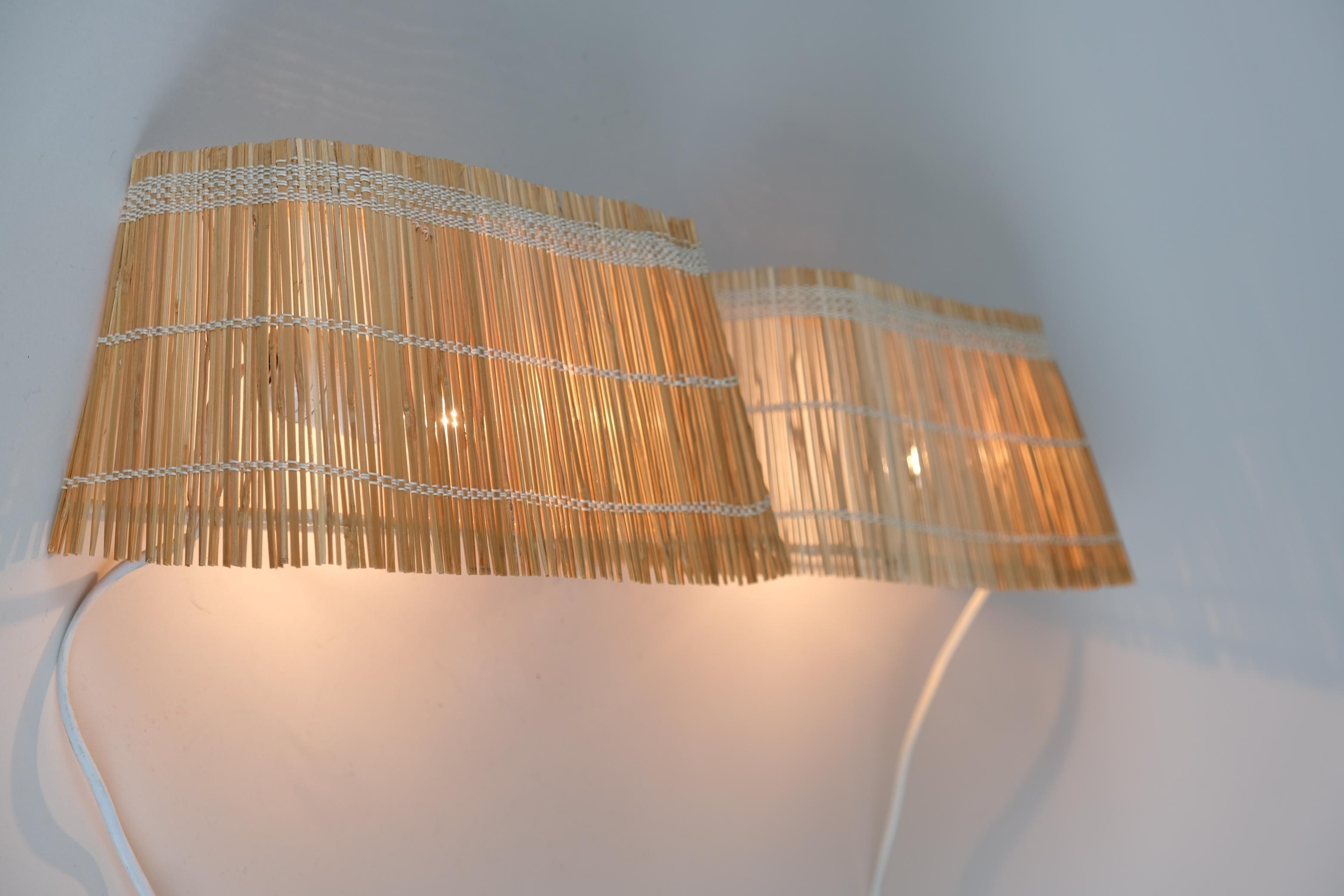 This type wall lamps was made by almost all lamp manufacturers in the 1930-1960s including Taito, Idman, Itsu and Orno. When the light filters through the rattan shades the lamps have a very warm look that's very appealing to people. A simple