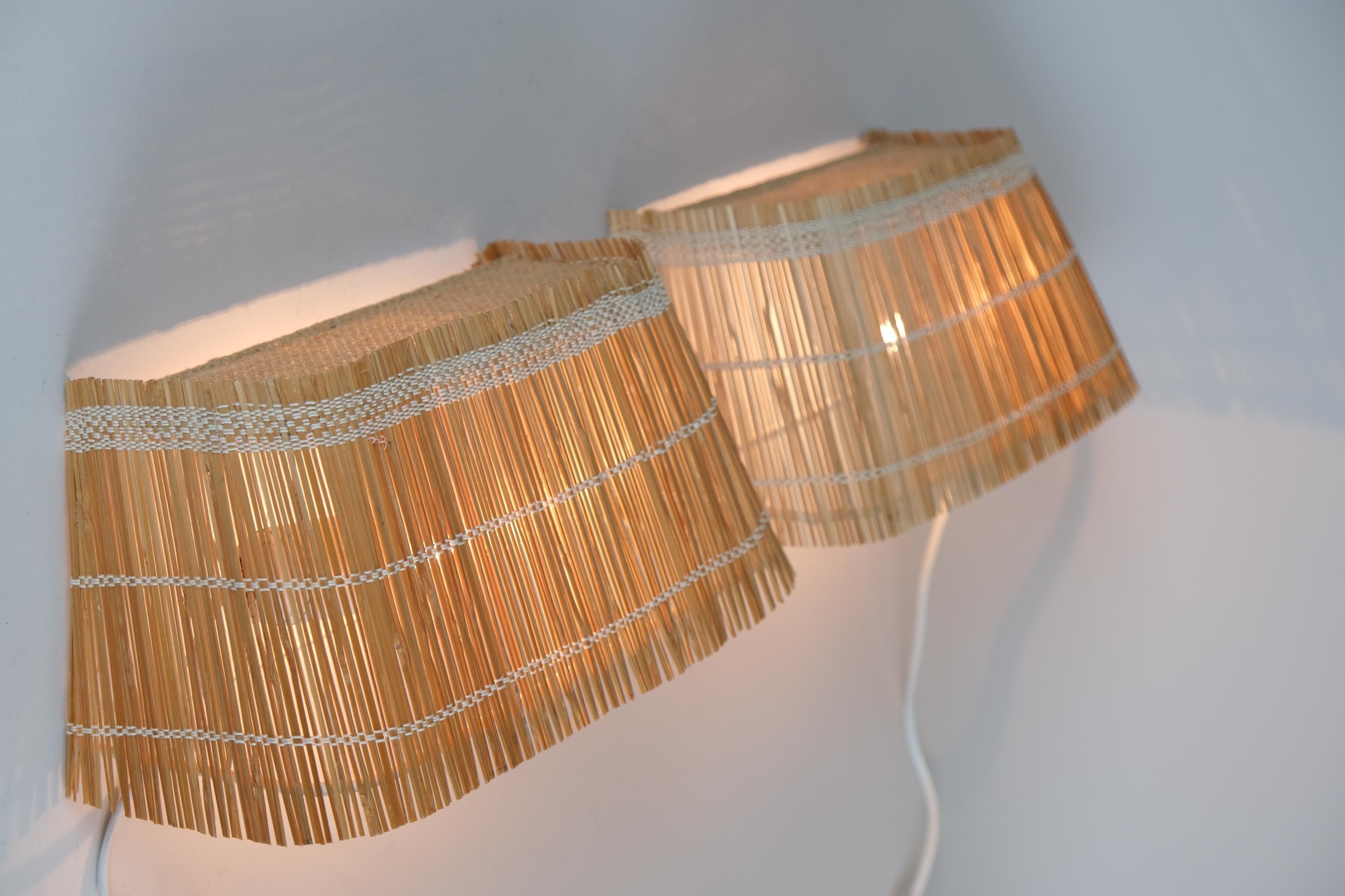 Scandinavian Modern A Pair of Mid-Century Reed, Metal and Natural Fabric Wall Lamps, Finland 1950s For Sale