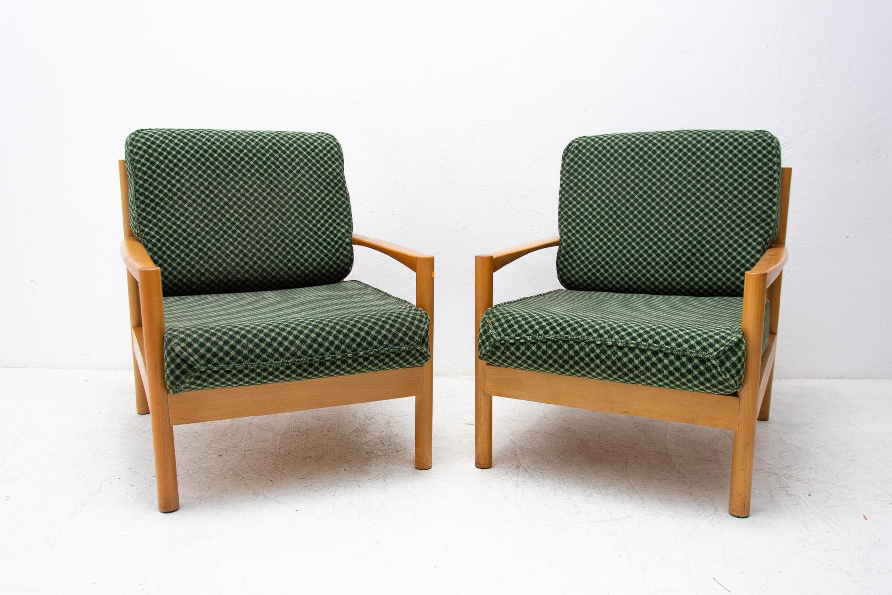 A pair of mid century armchairs in Scandinavian style, made in the 1970´s. It features beechwood structure and removable cushions in very good condition. The chairs are fully functional, but it can shows signs of age and using. Overall in very good