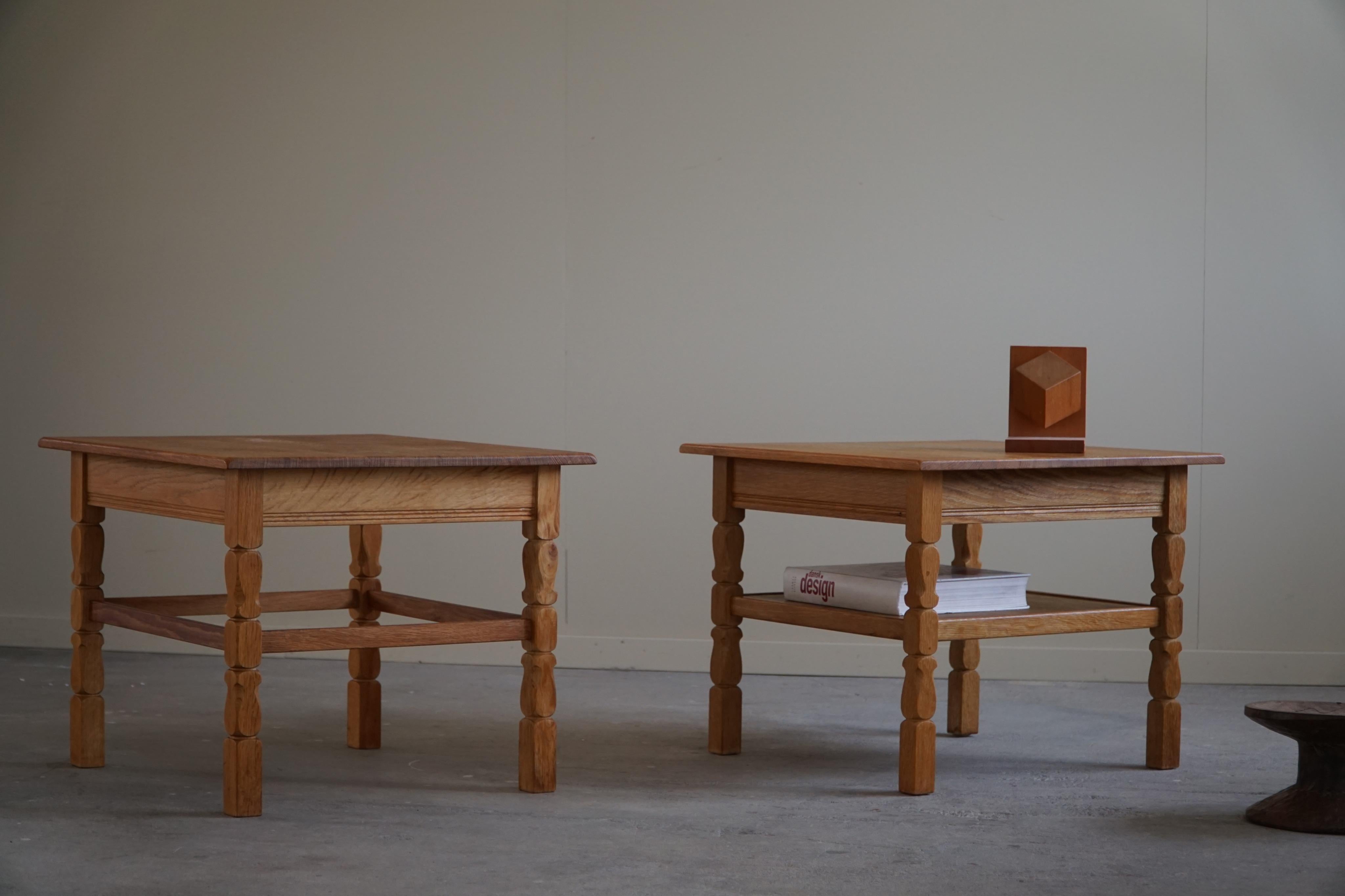 A pair of square sofa / side tables in solid oak. Made by a Danish cabinetmaker in the 1960s. 

Curved legs and great craftsmanship in these brutalist tables.
Light signs of wear on the surface.
These lovely tables will complement many interior