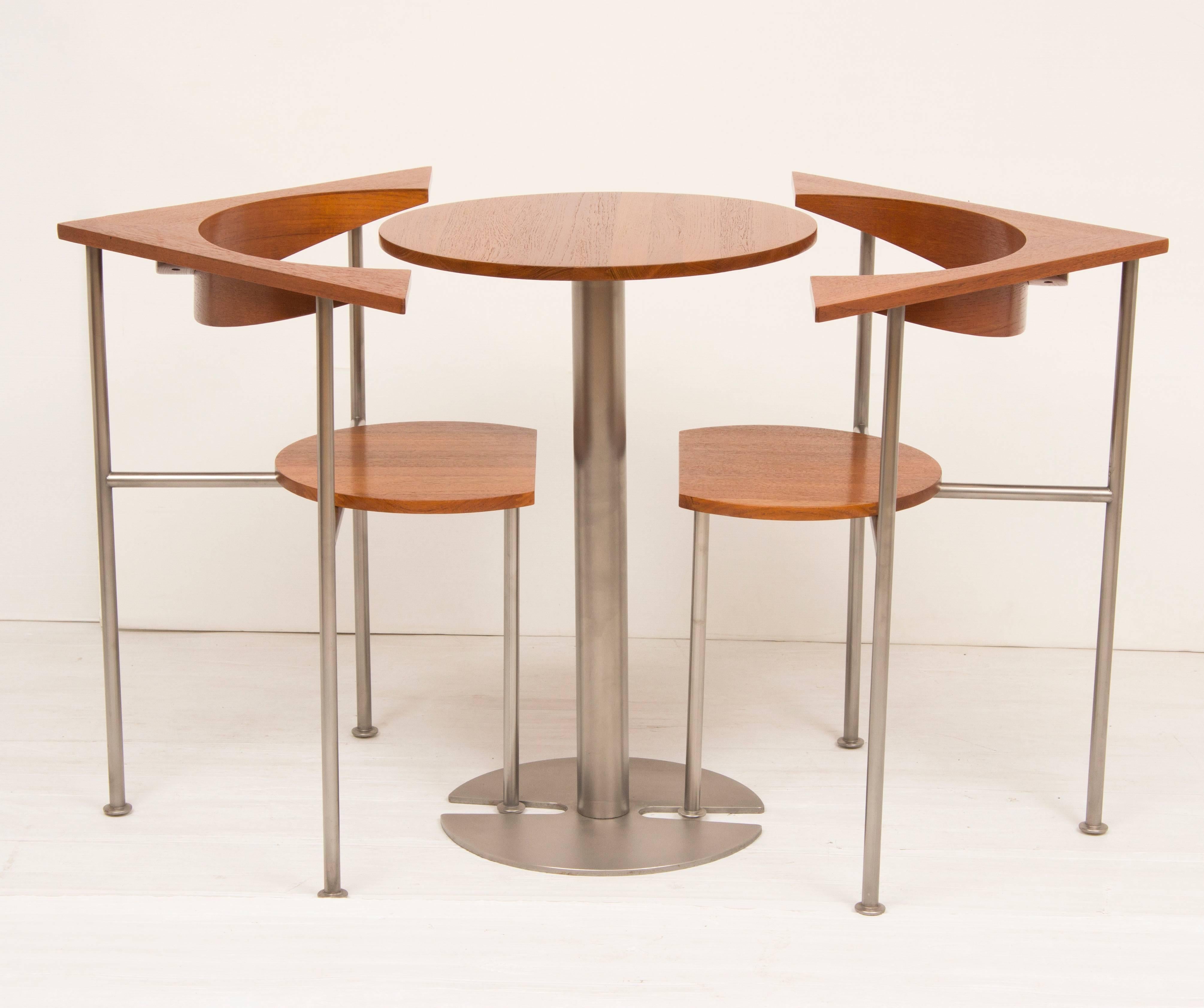 Mid-Century Modern design table and chairs unit.
Fantastic midcentury table and two chairs in teak and aluminium.
Superb design, square table concealing circular table and two chairs, the chairs have adjustable seats, back and forth.
Designed by