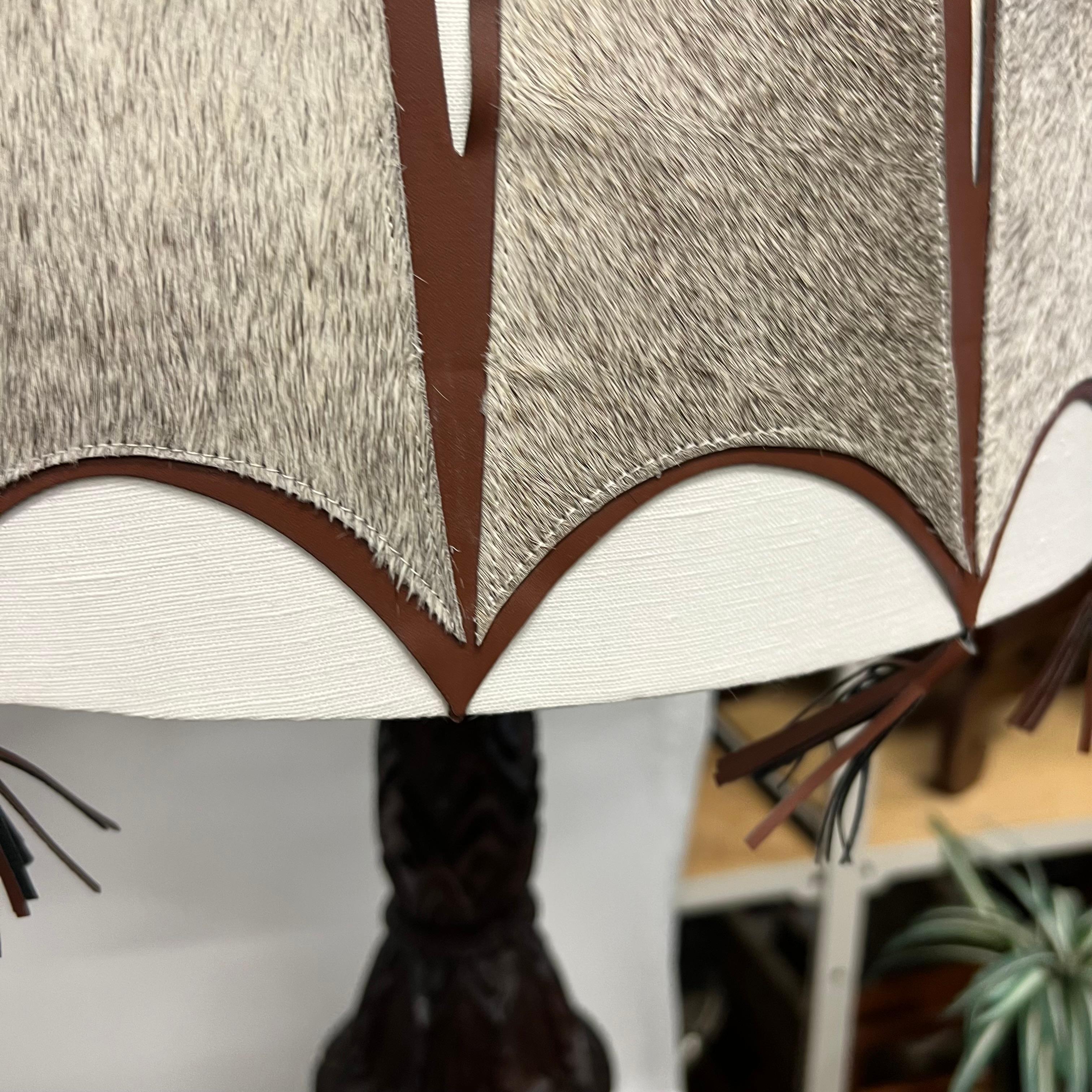 A pair of Mid-Century Tall Carved Wood Relief Lamps With Leather and Fur Shades For Sale 13
