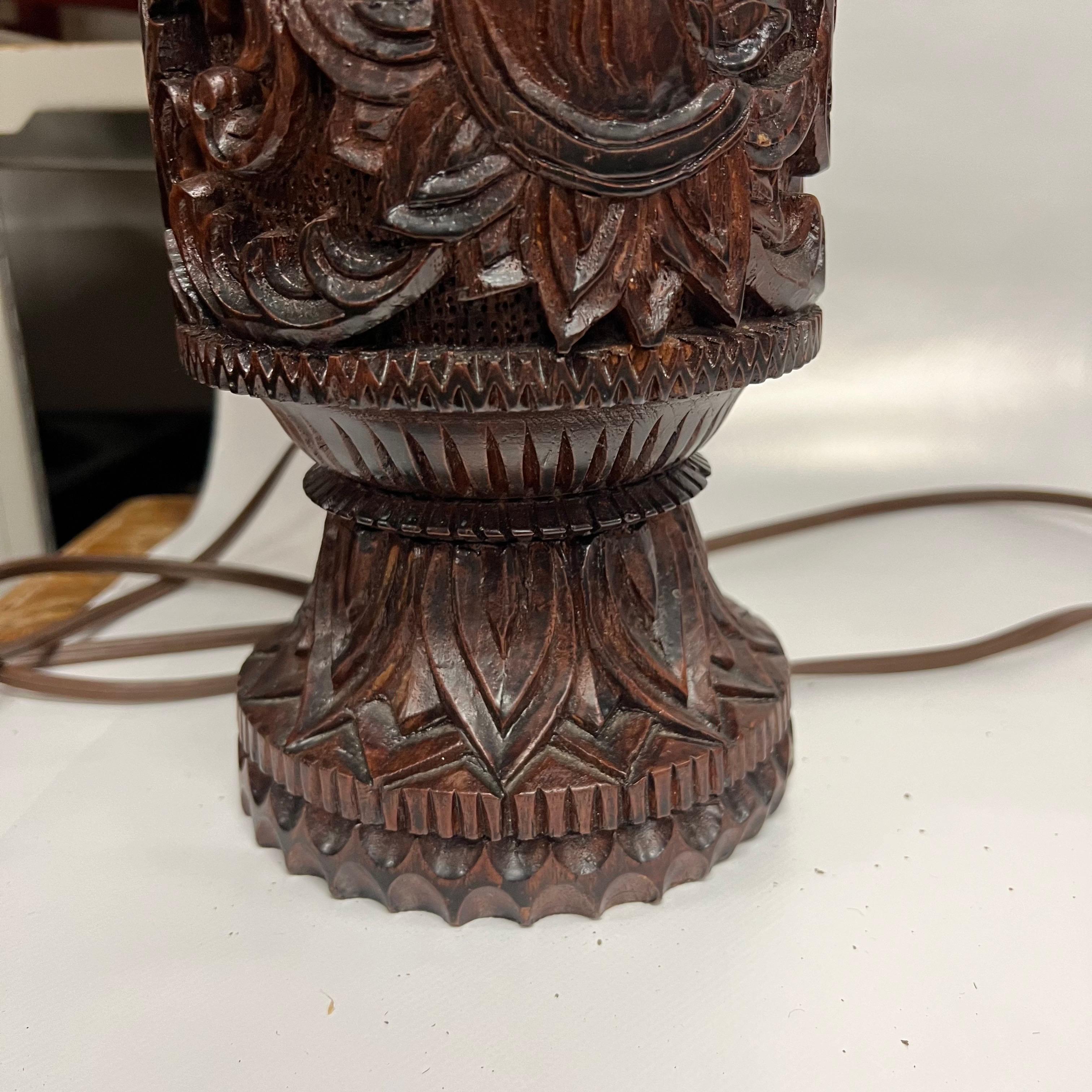 A pair of Mid-Century Tall Carved Wood Relief Lamps With Leather and Fur Shades For Sale 1