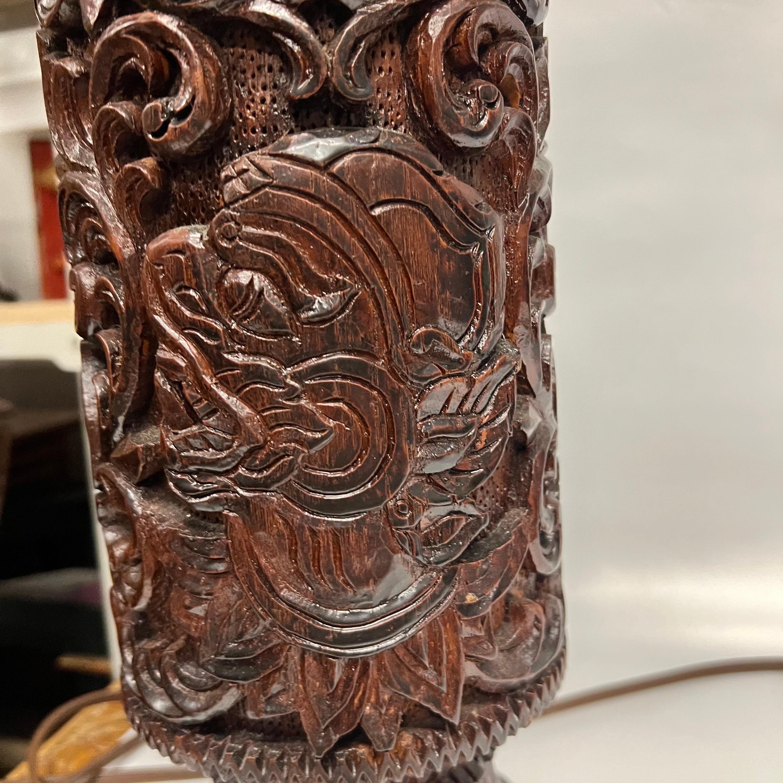 A pair of Mid-Century Tall Carved Wood Relief Lamps With Leather and Fur Shades For Sale 3