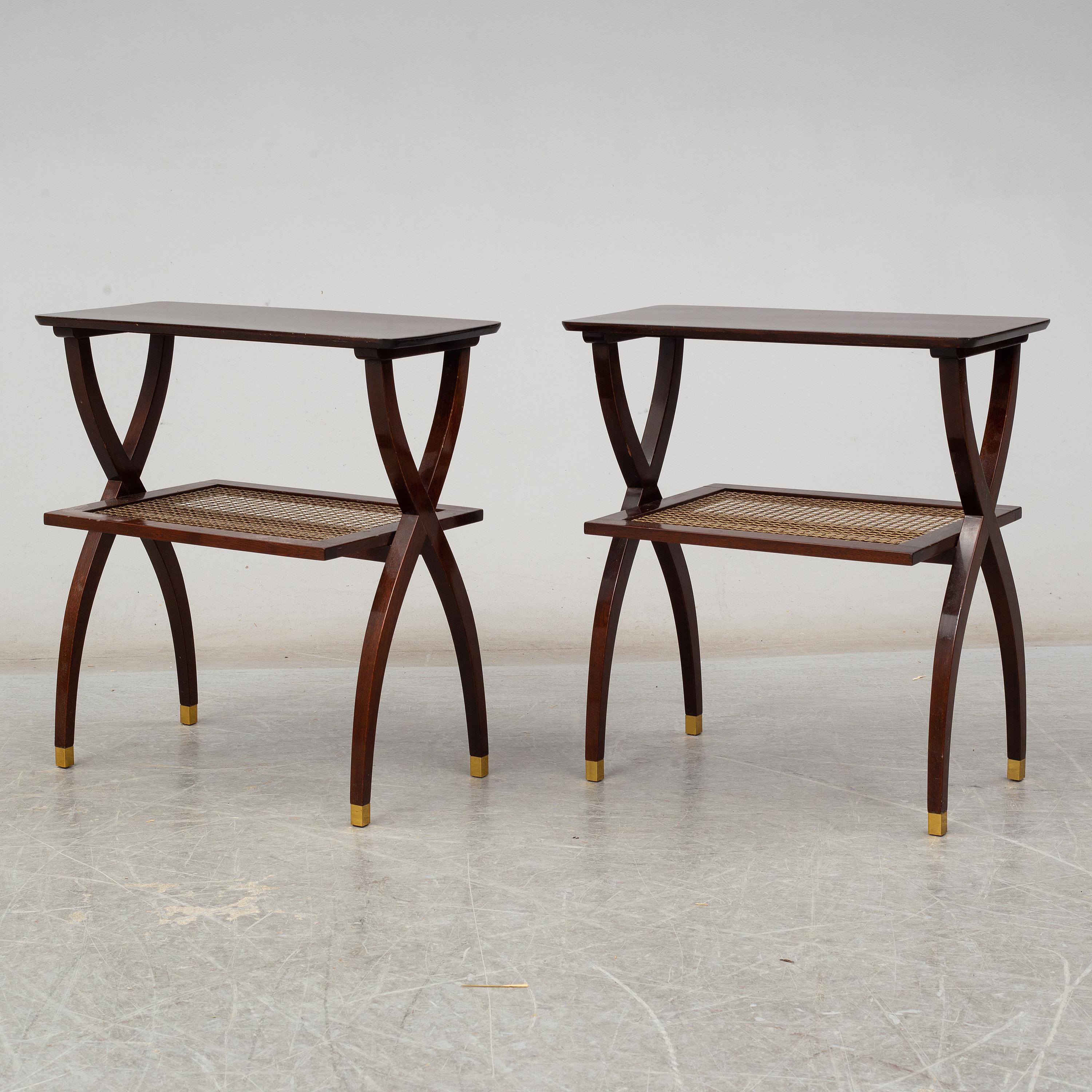 A pair of mid-20th century tables, wood with a woven brass shelves, brass detailing on feet.

Top is 9.25