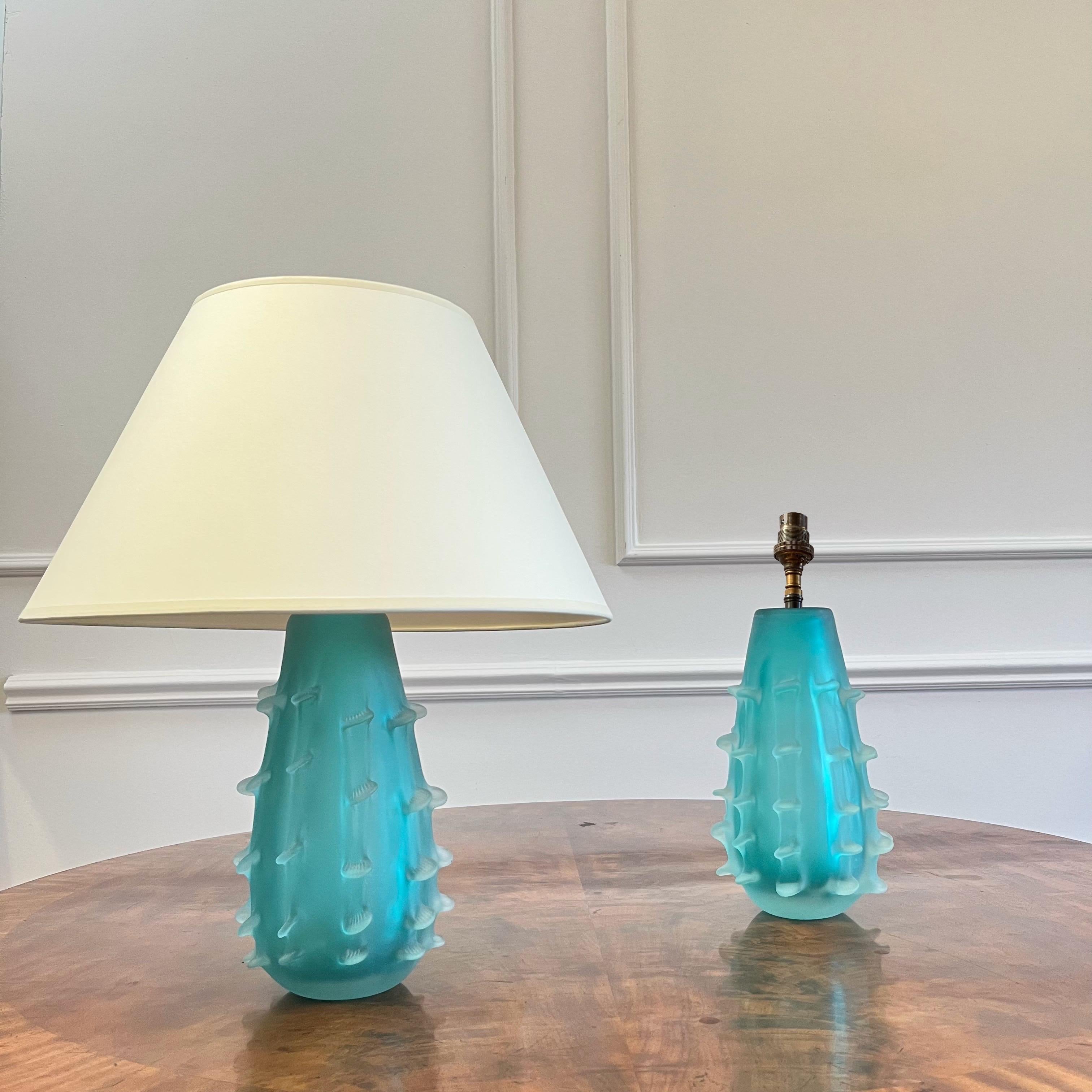 An exuberant pair of murano vases, evoking cactus forms in an an electrifying acid blue glass, now lamped. 

Italian, Mid Twentieth Century 