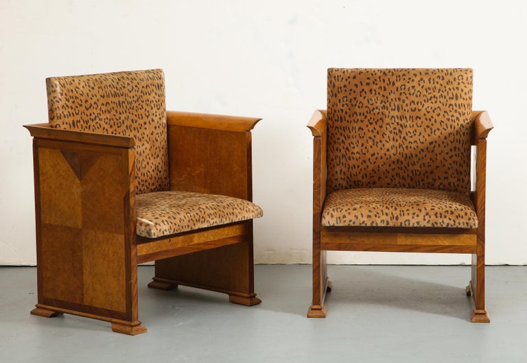 A pair of midcentury modern Italian walnut armchairs, 1930s. Parquet wood sides with curved edges along the tops of seat back and arms for comfort. Leopard print seat/back cushions connected with hinges. 

Tagged: Design Mobili, Furniture Sedute.