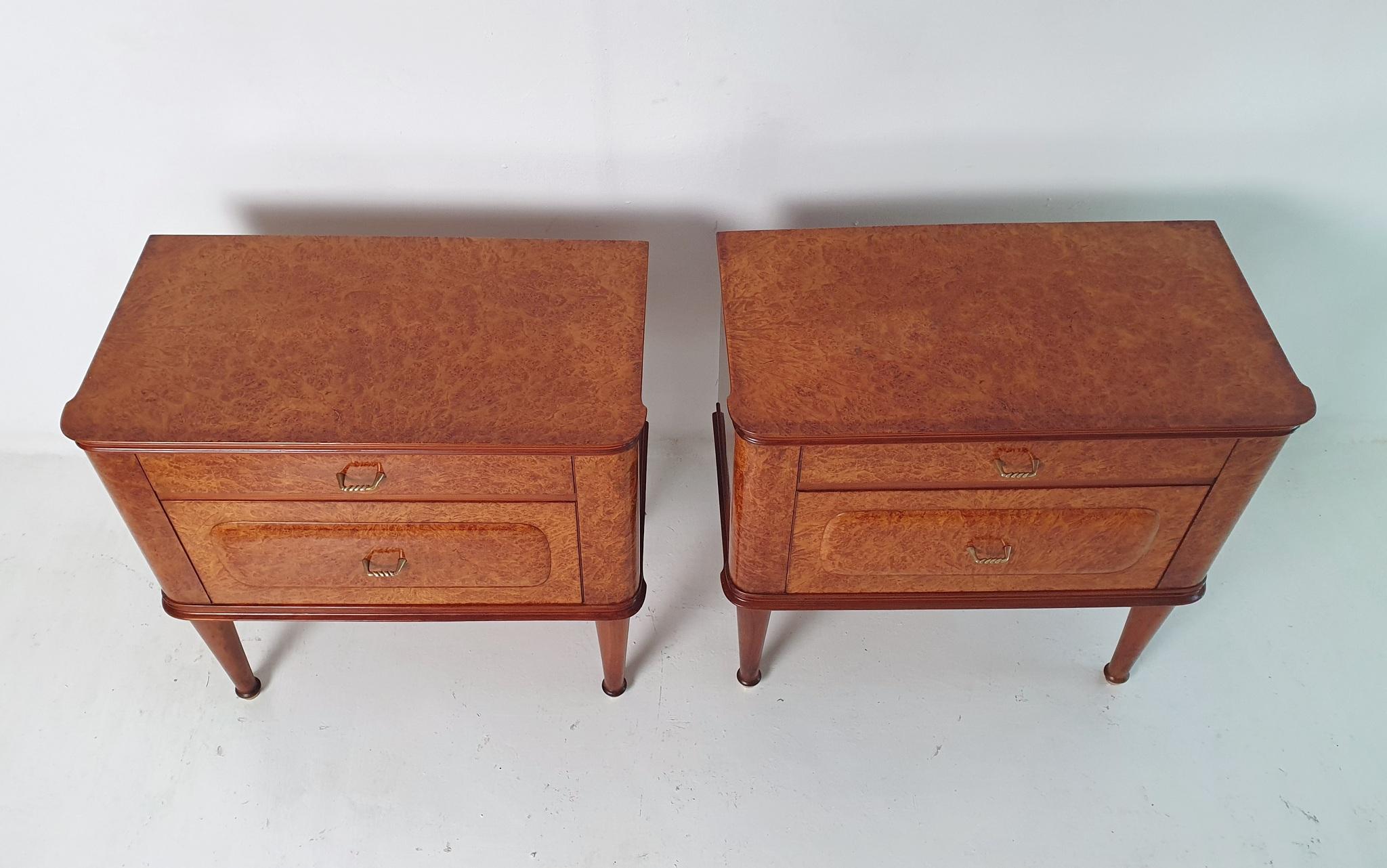 A pair of mid century Italian handmade nightstands made from birch root veneer and details in cherry wood. Each nightstand is equipped with a drawer and a 
small cabinet and adorned with details in brass. In excellent restored condition and very