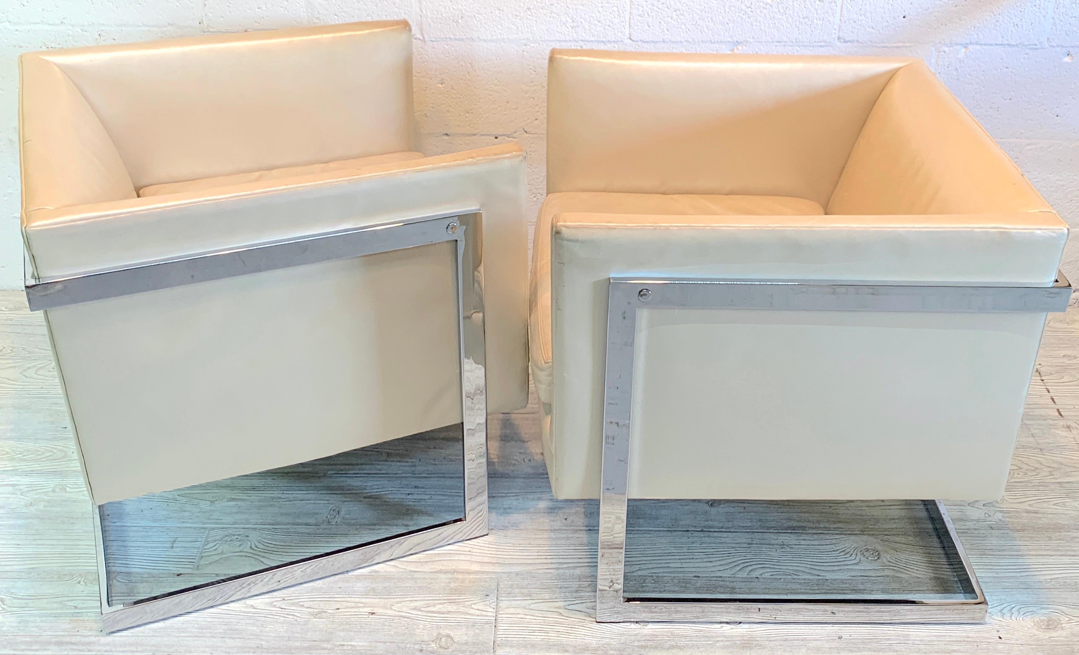 A pair of Milo Baughman floating cube chair frames, circa 1980
Great form with 'T' backs, each one upholstered in leather, the frames are bright and shiny.
The leather is worn, these are ready for reupholstery. Great size and scale.