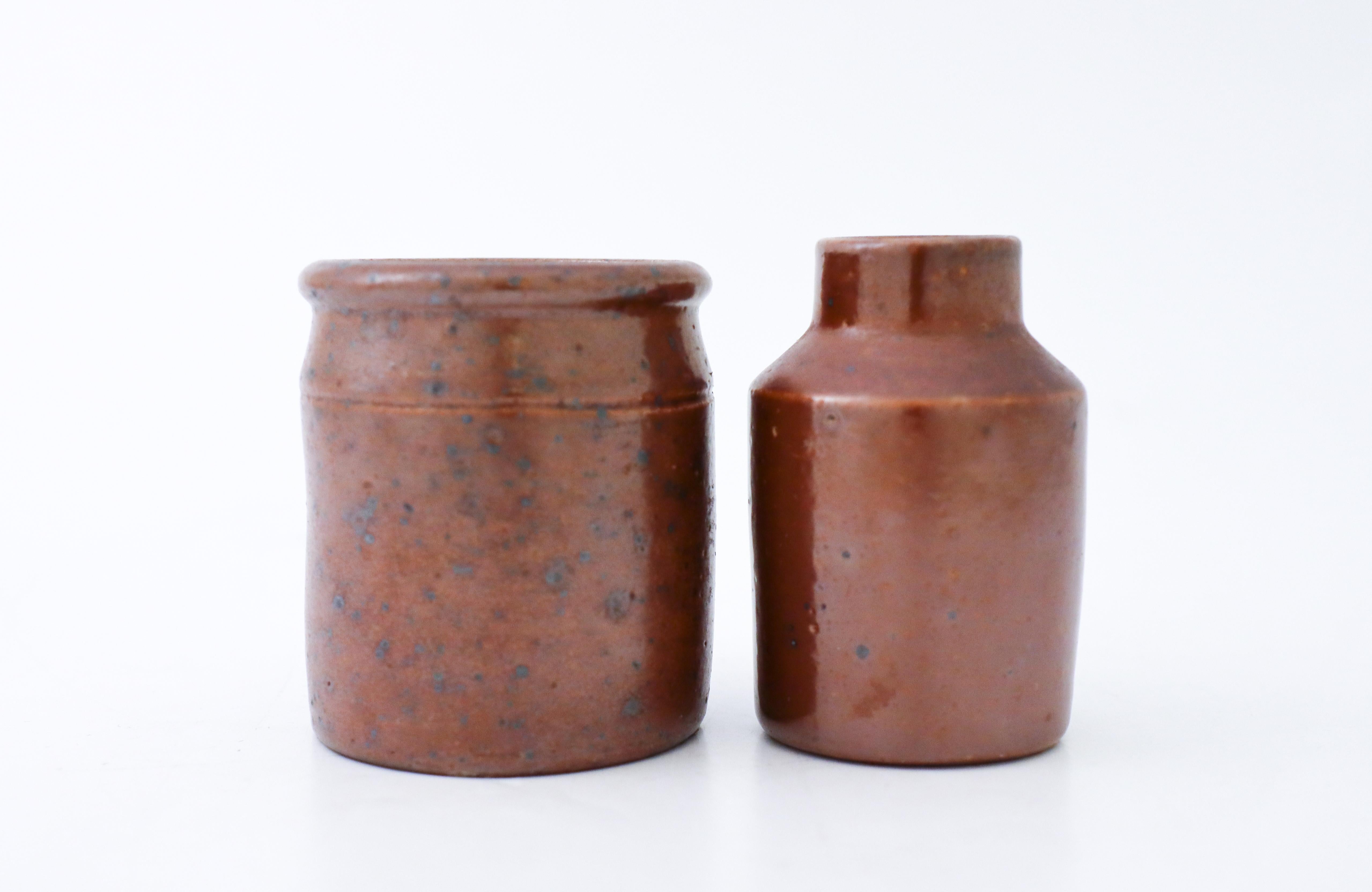 Two miniature stone jars produced at Raus in Helsingborg in Sweden. They are about 6.5 cm high and in excellent condition.