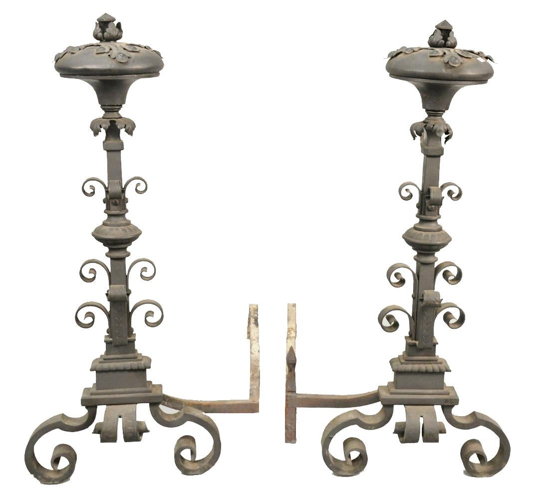 A pair of iron, Mizner style, over sized andirons.