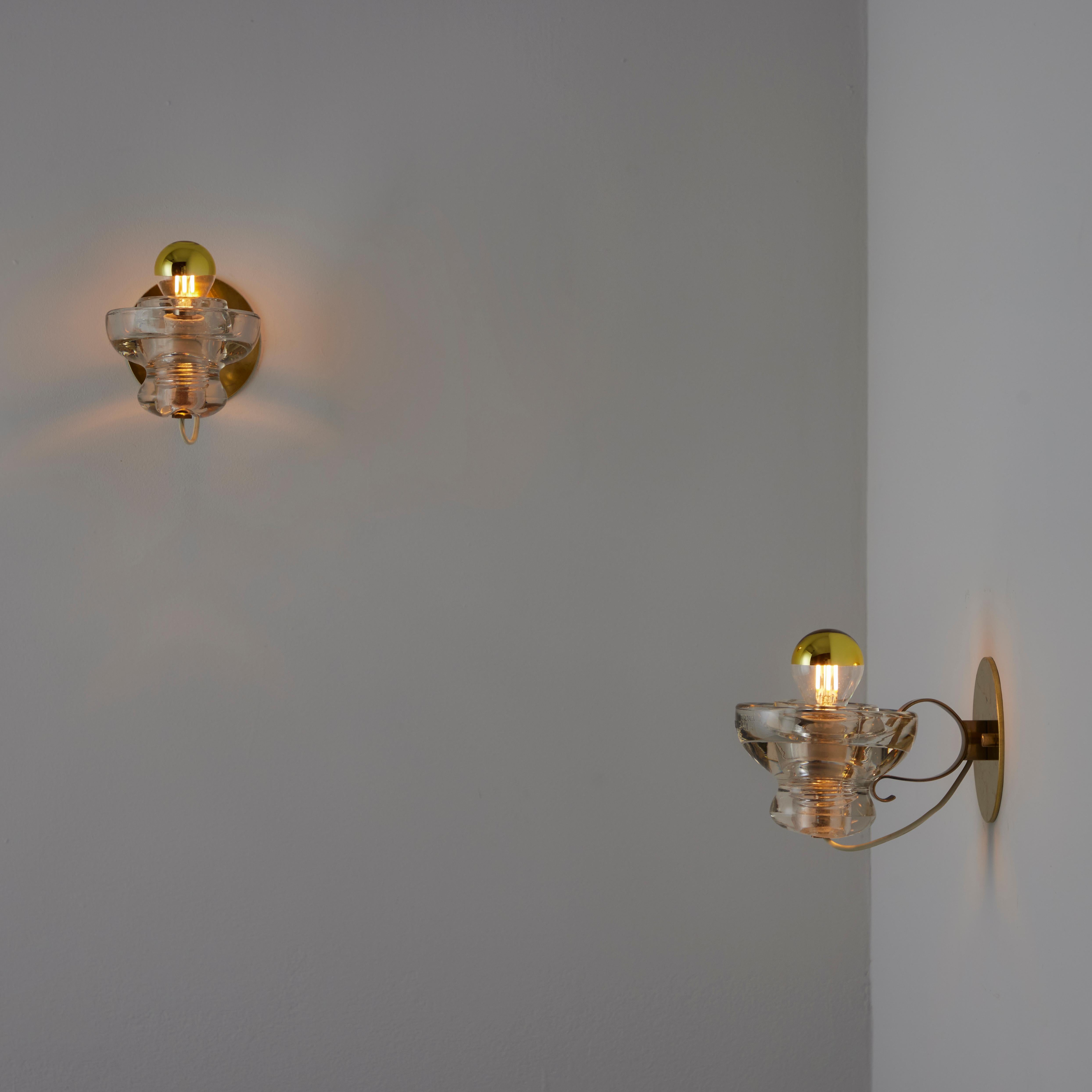 Italian A Pair of Model 1129 Sconces by Tito Agnoli for Oluce
