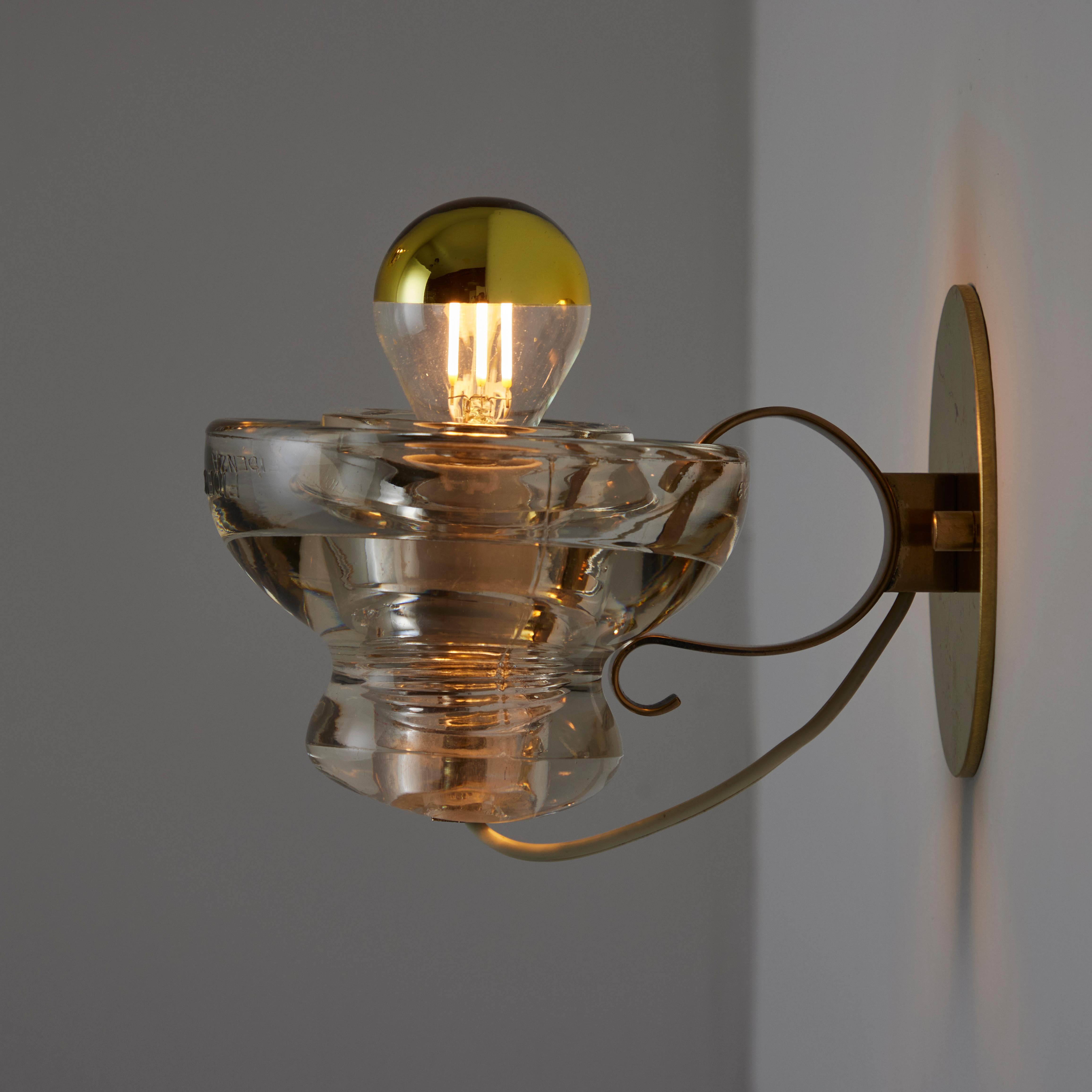 Polished A Pair of Model 1129 Sconces by Tito Agnoli for Oluce