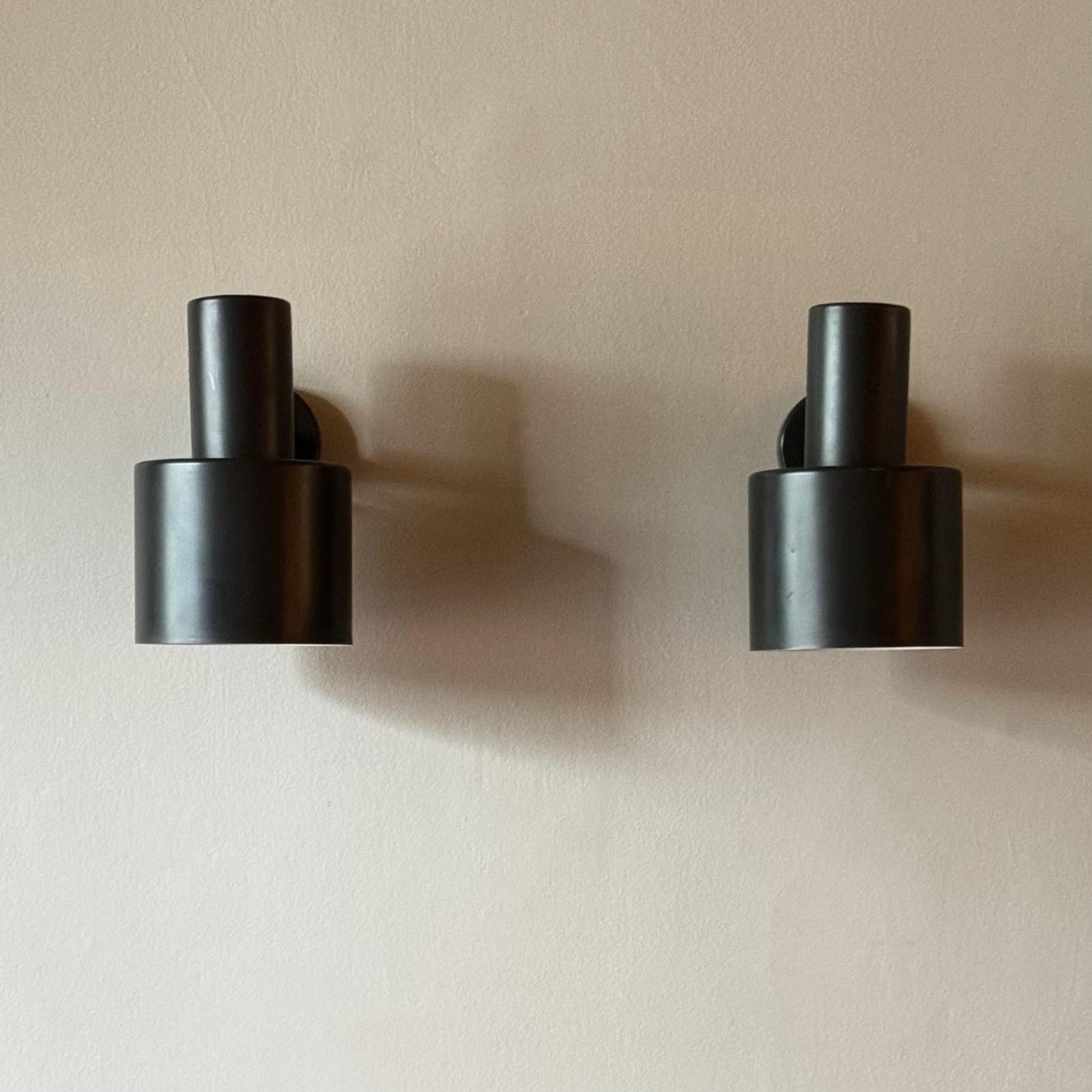 A pair of Model 13-017 Wall Lights designed by Lisa Johansson-Pape and manufactured by Orno in Finland during the 1960s. As one of Finland's leading lighting designers of the twentieth century, Johansson-Pape was a crucial figure in promoting